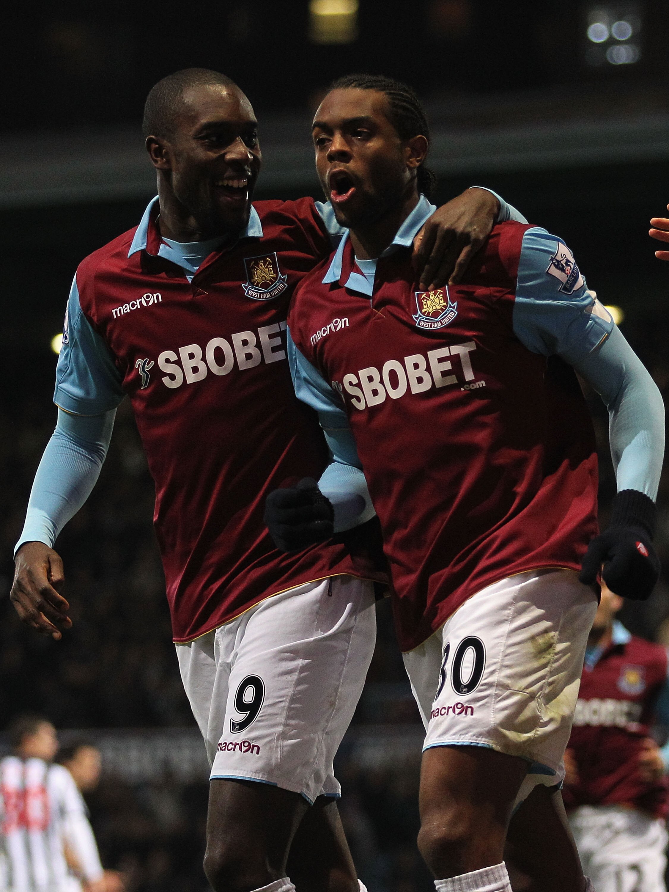 LONDON, ENGLAND - NOVEMBER 10:  Frederic Piquionne (R) of West Bromwich celebrates with team mate Carlton Cole after scoring their second goal from a penalty during the Barclays Premier League match between West Ham United and West Bromwich Albion at Bole