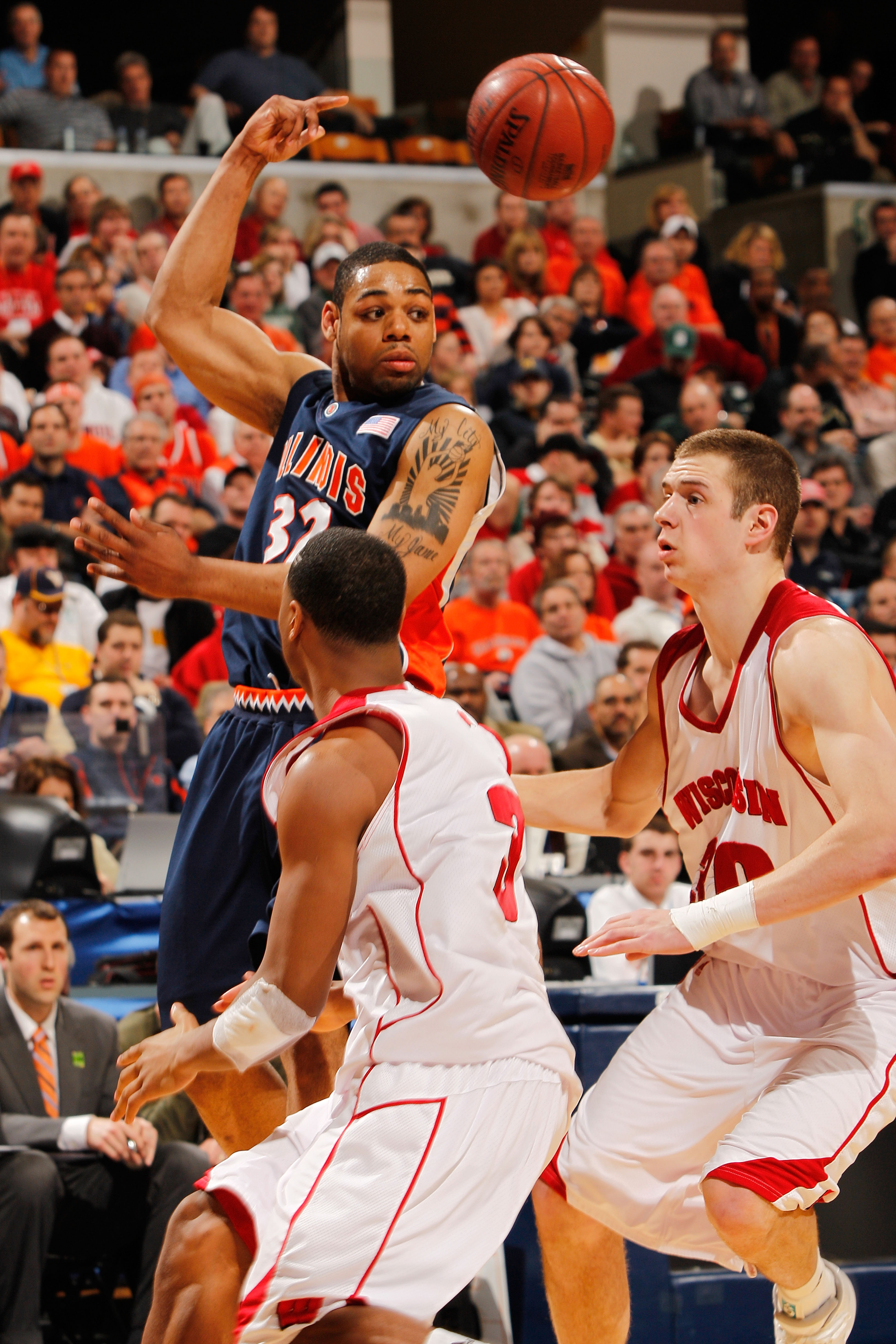 INDIANAPOLIS - MARCH 12:  Guard Demetri McCamey #32 of the Illinois Fighting Illini passes the ball against the Wisconsin Badgers during the quarterfinals of the Big Ten Men's Basketball Tournament at Conseco Fieldhouse on March 12, 2010 in Indianapolis,