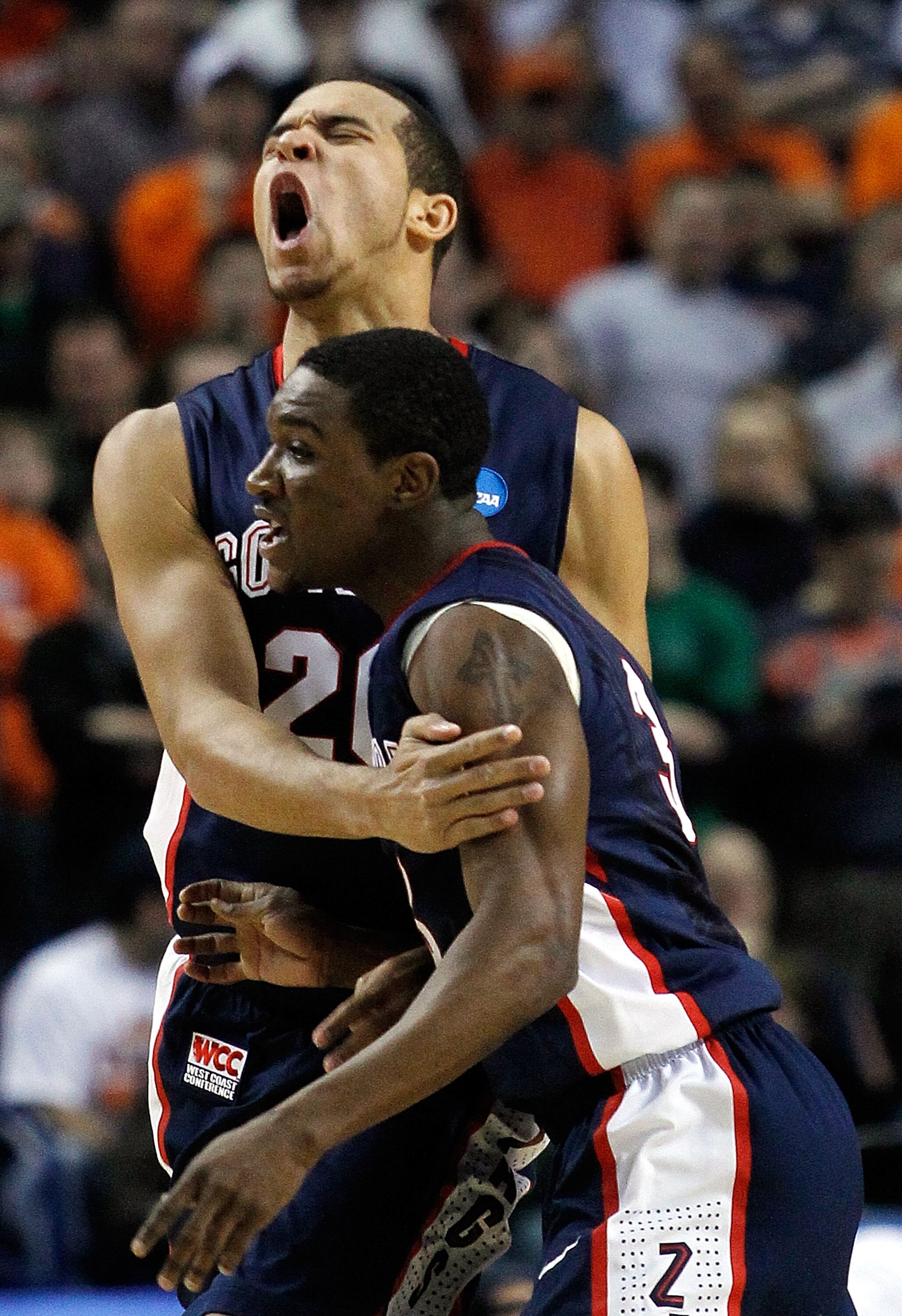 BUFFALO, NY - MARCH 21:  Elias Harris #20  of the Gonzaga Bulldogs reacts after a basket with teammate Demetri Goodson #3 of the Syracuse Orange during the second round of the 2010 NCAA men's basketball tournament at HSBC Arena at HSBC Arena on March 21,