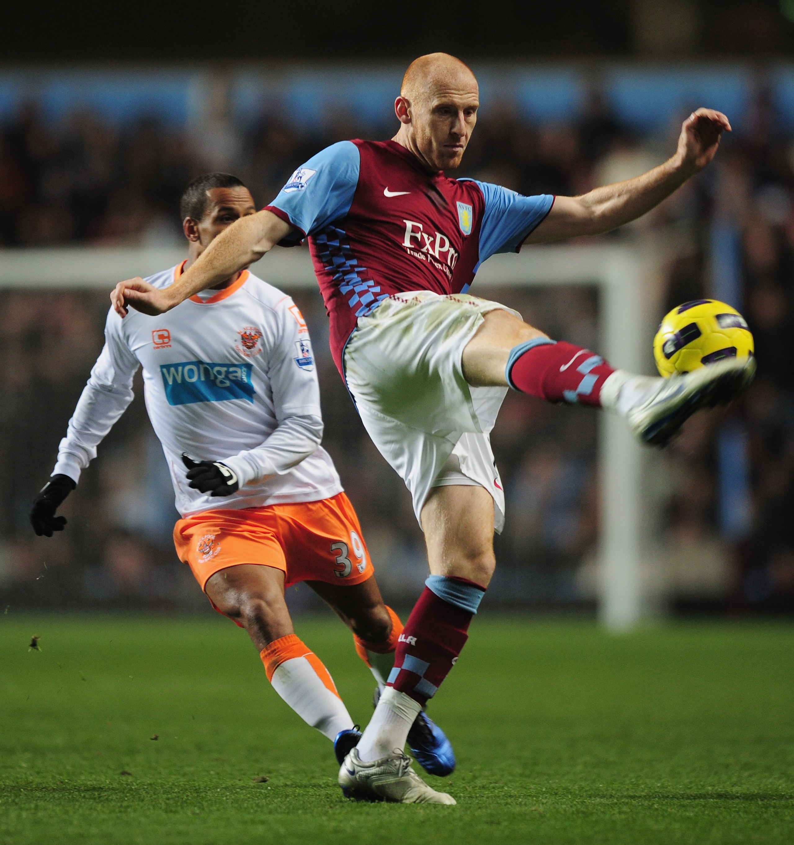 BIRMINGHAM, ENGLAND - NOVEMBER 10:  James Collins of Aston Villa clears the ball during the Barclays Premier League match between Aston Villa and Blackpool at Villa Park on November 10, 2010 in Birmingham, England.  (Photo by Shaun Botterill/Getty Images)