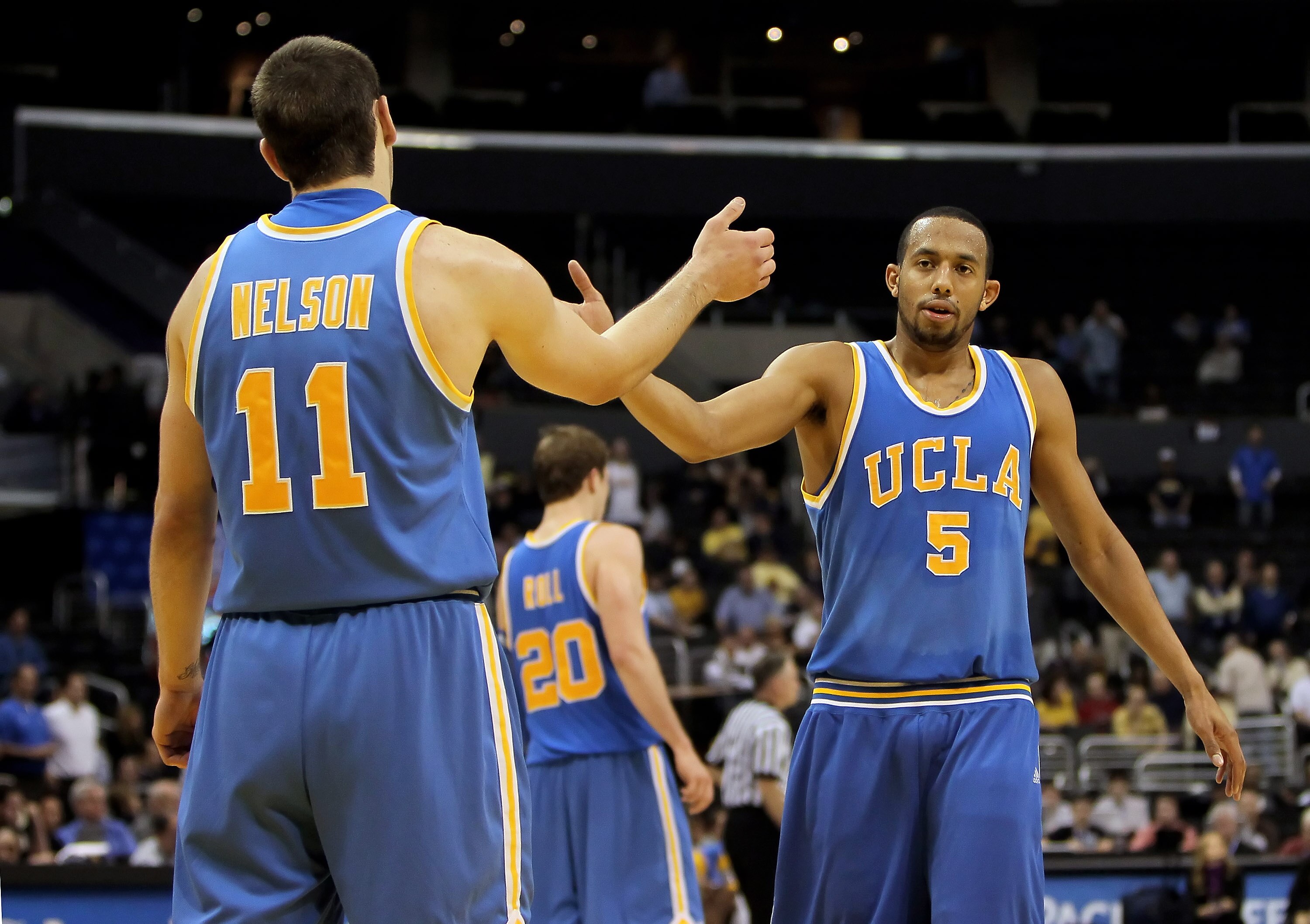 LOS ANGELES, CA - MARCH 11:  Reeves Nelson #11 and Jerime Anderson #5 of the UCLA Bruins congratulate one another in the closing seconds of the game against the Arizona Wildcats during the Quarterfinals of the Pac-10 Basketball Tournament at Staples Cente
