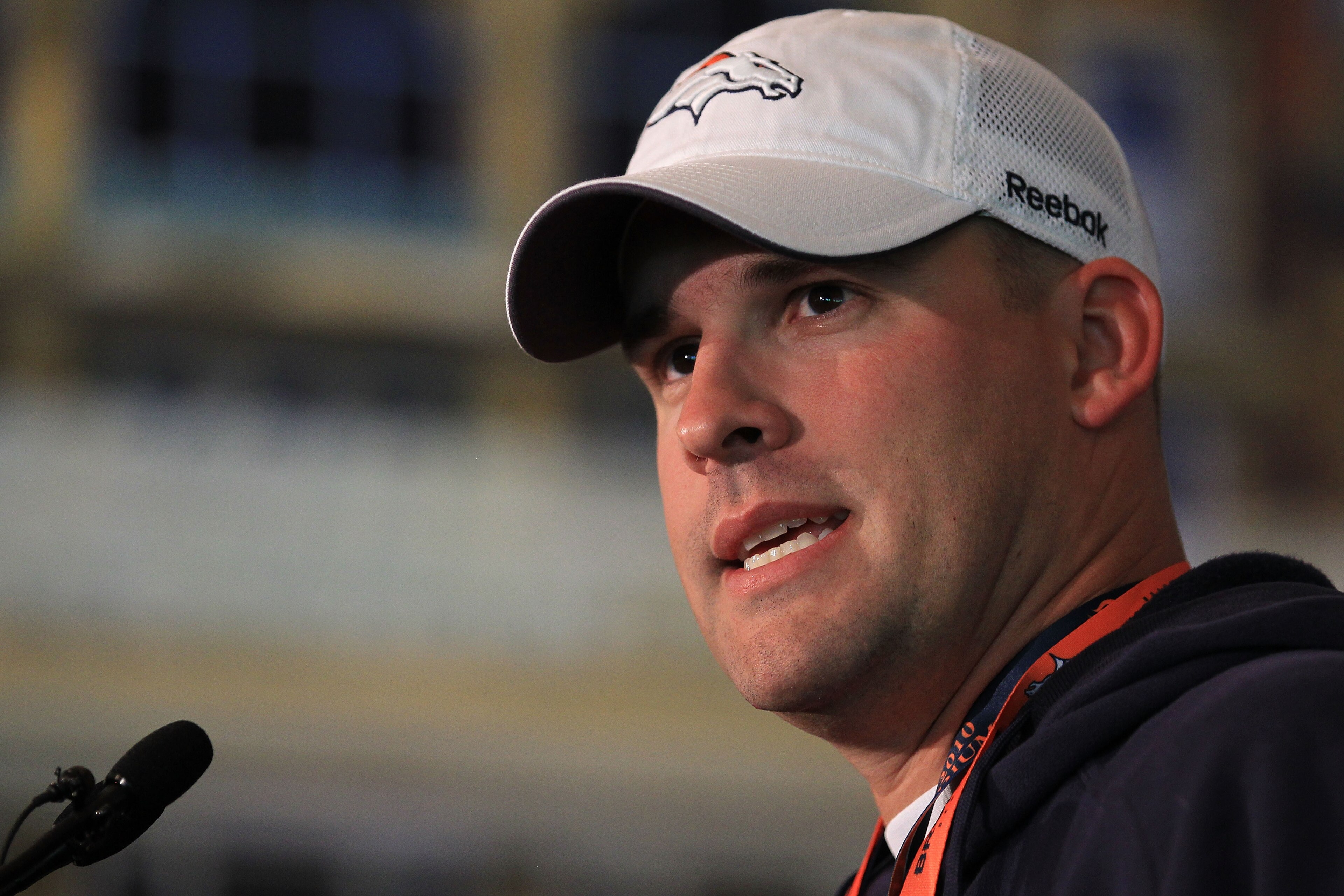 LONDON, ENGLAND - OCTOBER 29:  Head coach of the Denver Broncos Josh McDaniels speaks to the media during a press conference prior to the start of a team training session at The Brit Oval on October 29, 2010 in London, England. The Denver Broncos will pla