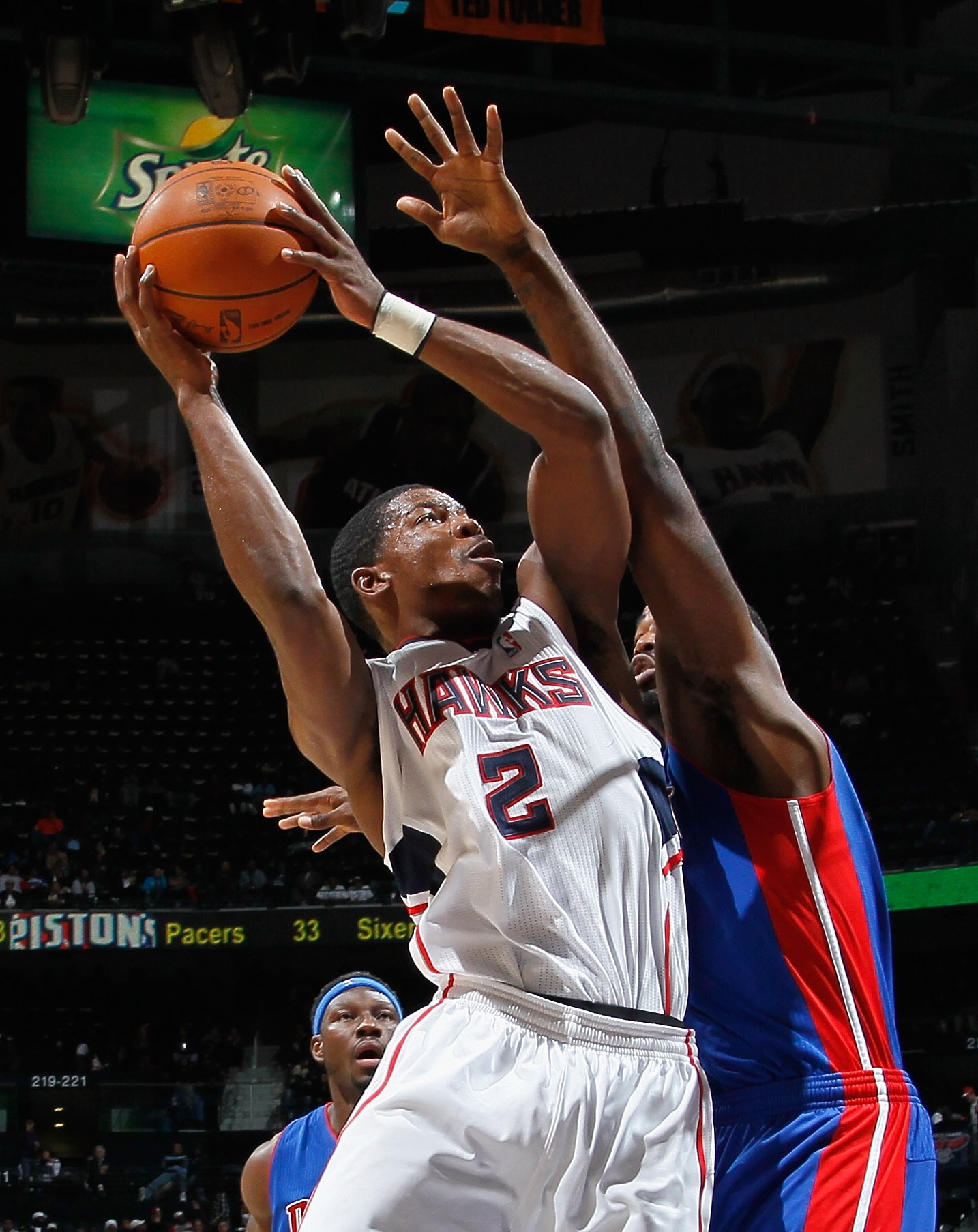 ATLANTA - NOVEMBER 03:  Joe Johnson #2 of the Atlanta Hawks drives against DaJuan Summers #35 of the Detroit Pistons at Philips Arena on November 3, 2010 in Atlanta, Georgia.  NOTE TO USER: User expressly acknowledges and agrees that, by downloading and/o