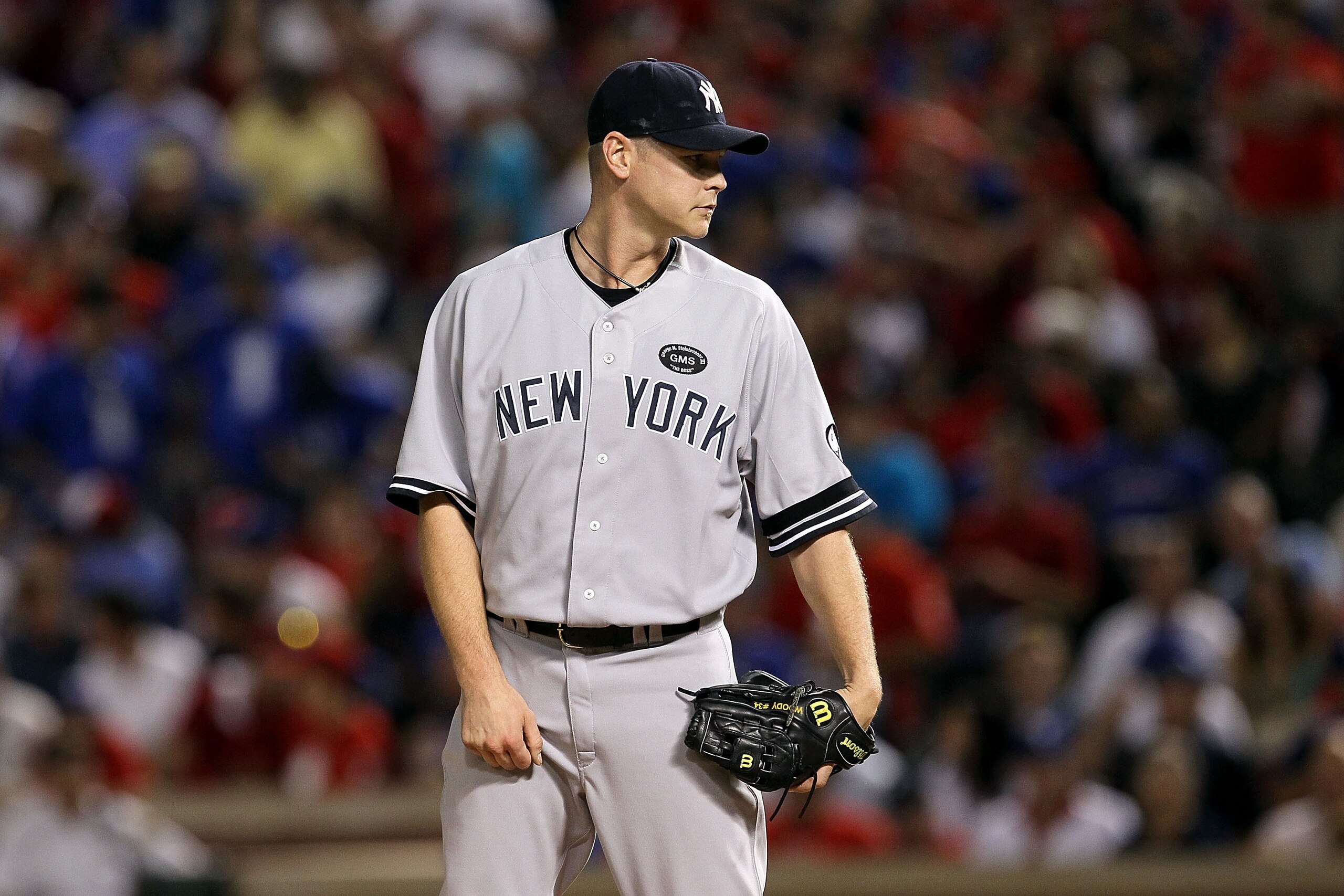 ARLINGTON, TX - OCTOBER 22: Kerry Wood #39 of the New York Yankees gets set to throw a pitch against the Texas Rangers in Game Six of the ALCS during the 2010 MLB Playoffs at Rangers Ballpark in Arlington on October 22, 2010 in Arlington, Texas. The Rang ARLINGTON, TX - OCTOBER 22: Kerry Wood #39 of the New York Yankees gets set to throw a pitch against the Texas Rangers in Game Six of the ALCS during the 2010 MLB Playoffs at Rangers Ballpark in Arlington on October 22, 2010 in Arlington, Texas. The Rang
