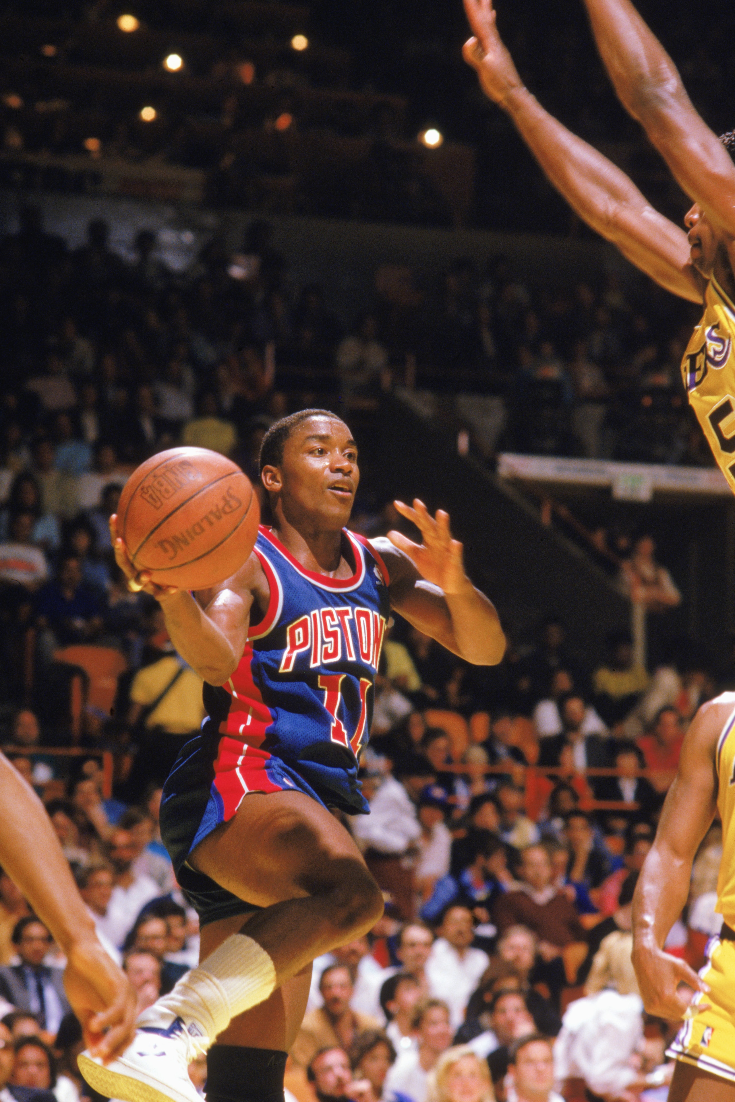 LOS ANGELES - 1986: Isiah Thomas #11 of the Detroit Pistons looks to pass in a game against the Los Angeles Lakers at the Great Western Forum in Los Angeles, California during the 1986-1987 NBA season. (Photo by Jonathan Daniel/Getty Images) LOS ANGELES - 1986: Isiah Thomas #11 of the Detroit Pistons looks to pass in a game against the Los Angeles Lakers at the Great Western Forum in Los Angeles, California during the 1986-1987 NBA season. (Photo by Jonathan Daniel/Getty Images)