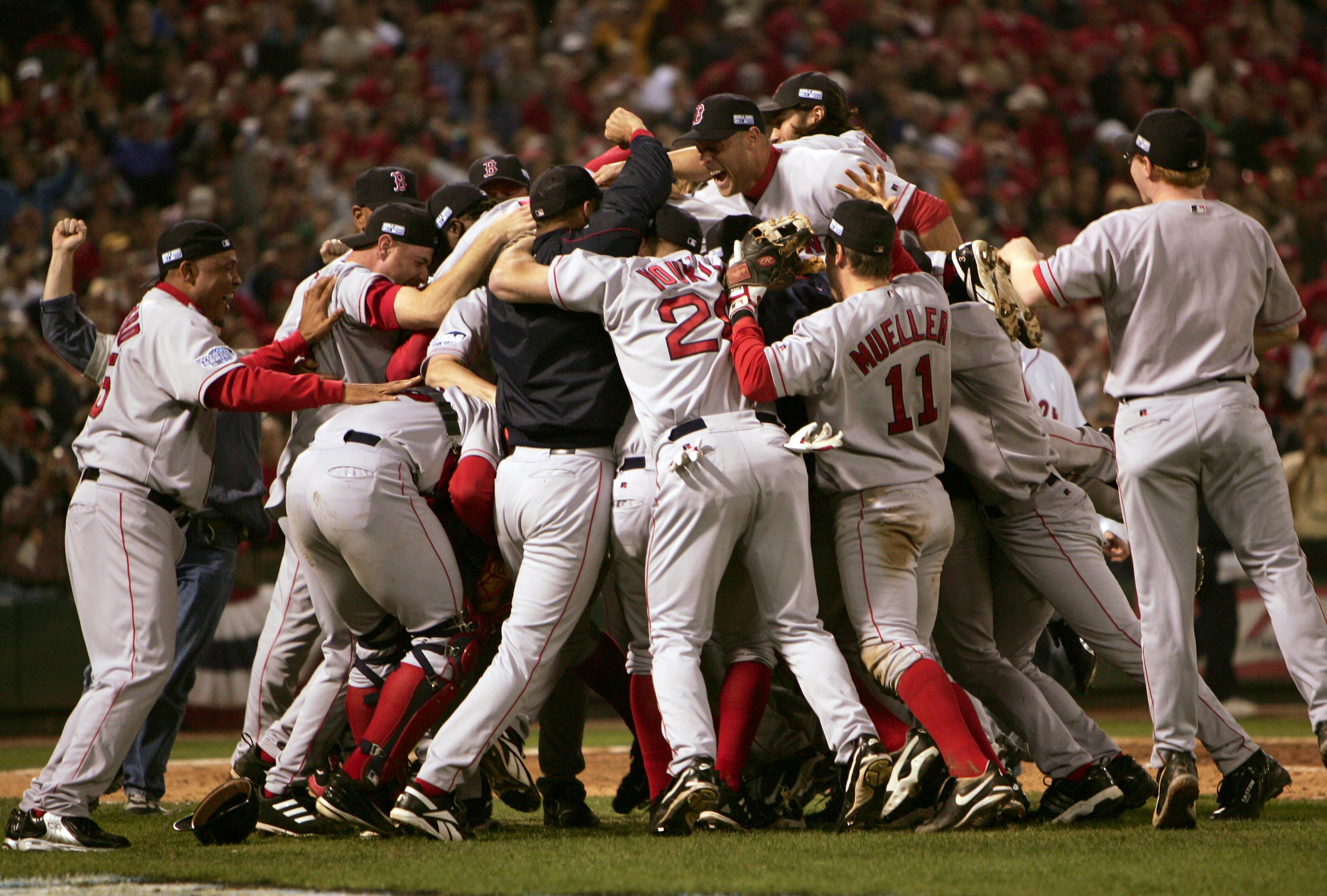 ST LOUIS - OCTOBER 27:   The Boston Red Sox celebrate on the field after defeating the St. Louis Cardinals 3-0 in game four of the World Series on October 27, 2004 at Busch Stadium in St. Louis, Missouri. (Photo by Jed Jacobsohn/Getty Images)