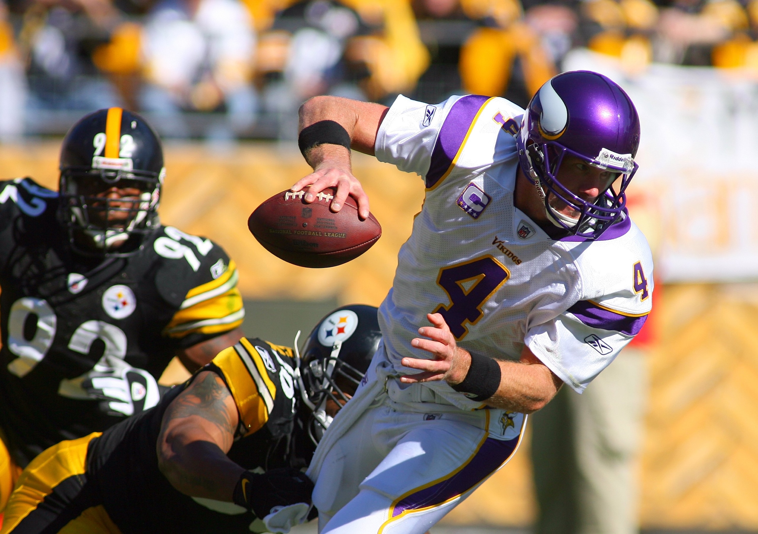 PITTSBURGH - OCTOBER 25: Quarterback Brett Favre #4 of the Minnesota Vikings tries to break free of a tackle during the NFL game against the Pittsburgh Steelers at Heinz Field on October 25, 2009 in Pittsburgh, Pennsylvania. The Steelers defeated the Vik PITTSBURGH - OCTOBER 25: Quarterback Brett Favre #4 of the Minnesota Vikings tries to break free of a tackle during the NFL game against the Pittsburgh Steelers at Heinz Field on October 25, 2009 in Pittsburgh, Pennsylvania. The Steelers defeated the Vik