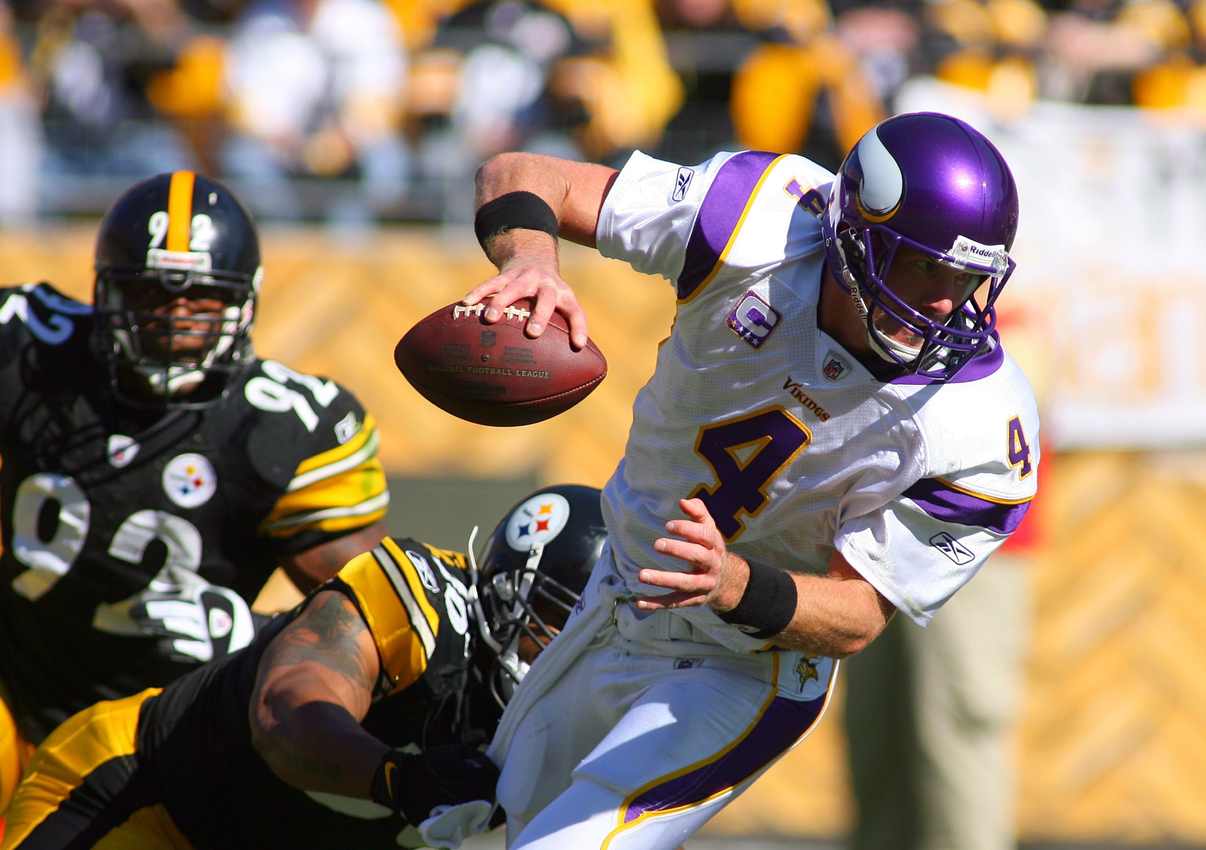 PITTSBURGH - OCTOBER 25:  Quarterback Brett Favre #4 of the Minnesota Vikings tries to break free of a tackle during the NFL game against the Pittsburgh Steelers at Heinz Field on October 25, 2009 in Pittsburgh, Pennsylvania. The Steelers defeated the Vik