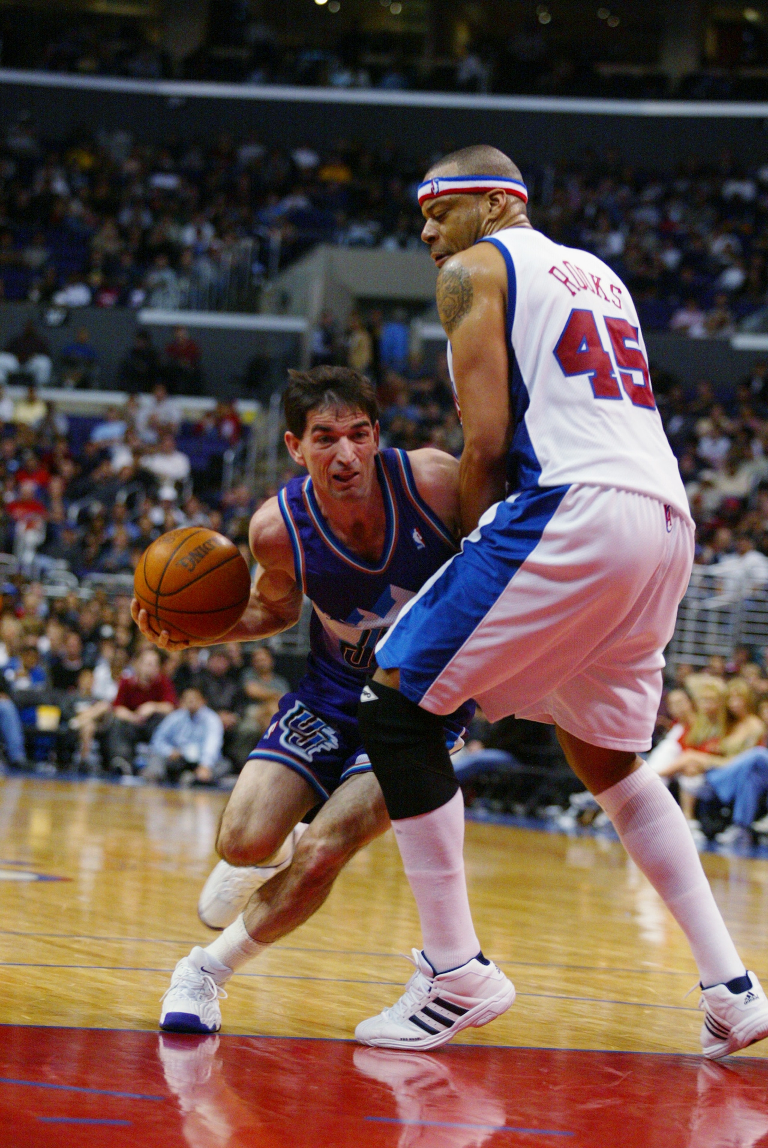 LOS ANGELES - APRIL 1: John Stockton #12 of the Utah Jazz drives against Elton Brand #42 of the Los Angeles Clippers during the game at Staples Center on April 1, 2003 in Los Angeles, California. The Jazz won 94-89. NOTE TO USER: User expressly acknowl LOS ANGELES - APRIL 1: John Stockton #12 of the Utah Jazz drives against Elton Brand #42 of the Los Angeles Clippers during the game at Staples Center on April 1, 2003 in Los Angeles, California. The Jazz won 94-89. NOTE TO USER: User expressly acknowl