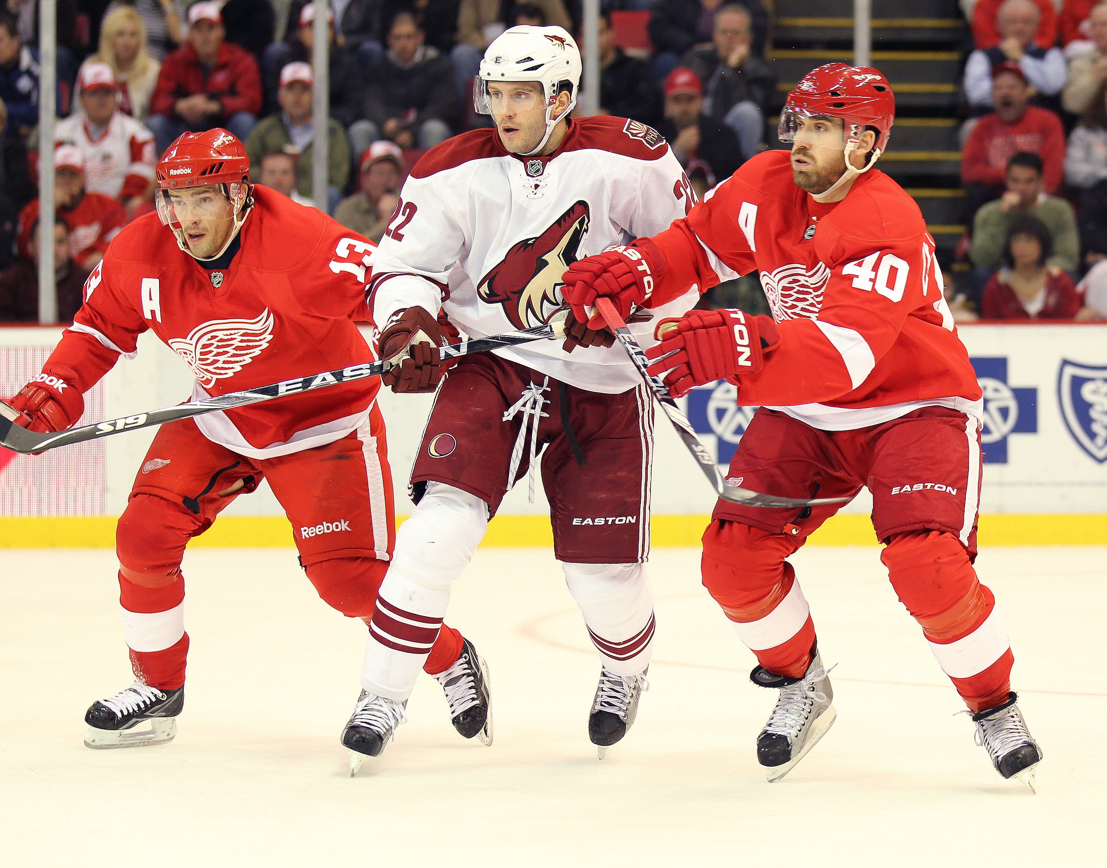 DETROIT, MI - NOVEMBER 8:  Pavel Datsyuk #13 and Henrik Zetterberg #40 of the Detroit Red Wings sandwich Lee Stempniak #22 of the Phoenix Coyotes in a game on November 8,2010 at the Joe Louis Arena in Detroit, Michigan. (Photo by Claus Andersen/Getty Imag