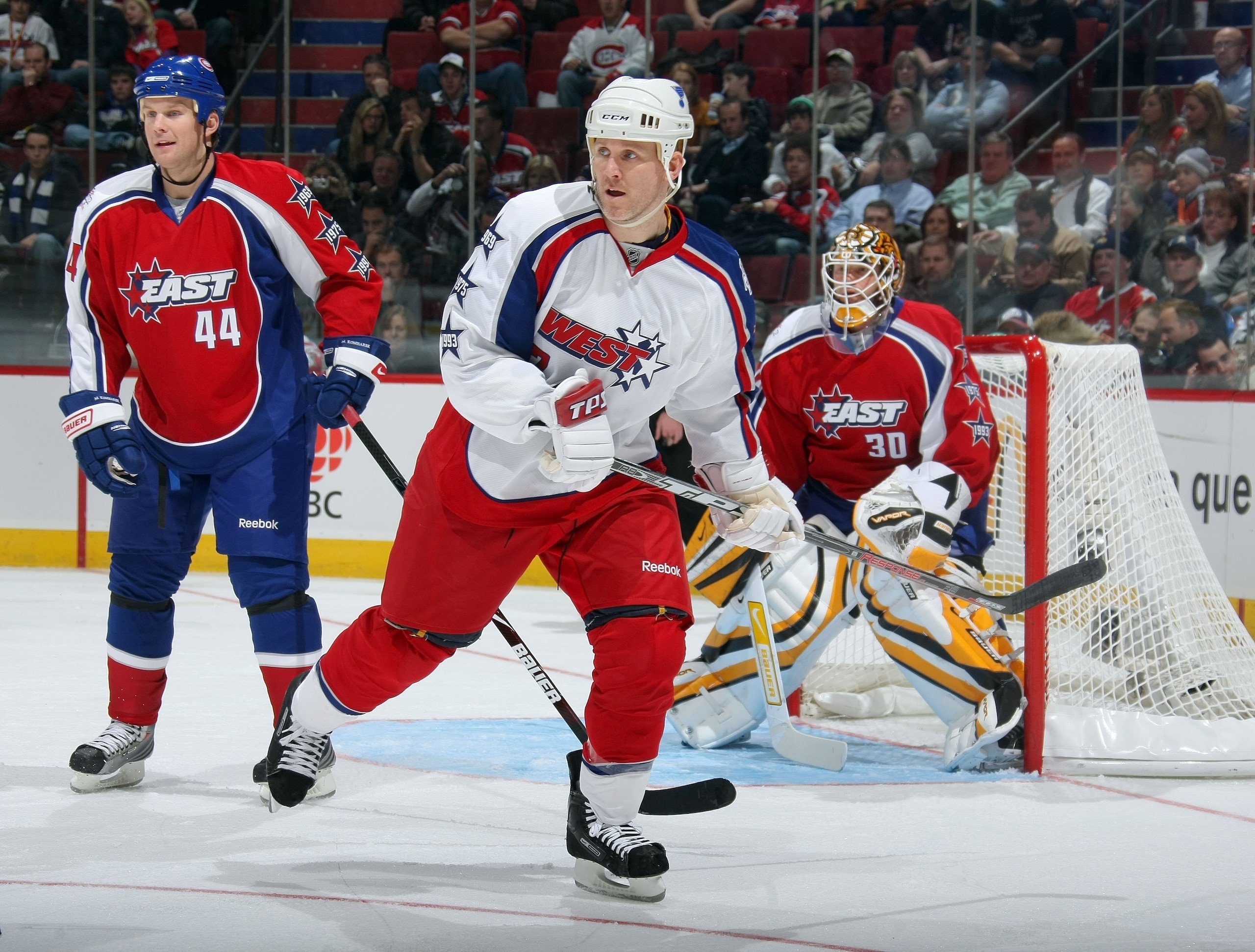 MONTREAL - JANUARY 25:  Keith Tkachuk #7 of the Western Conference All-Stars waits for a pass as Mike Komisarek #44 of the Eastern Conference defends the crease in front of goaltender Tim Thomas #30 during the 2009 NHL All-Star game at the Bell Centre on