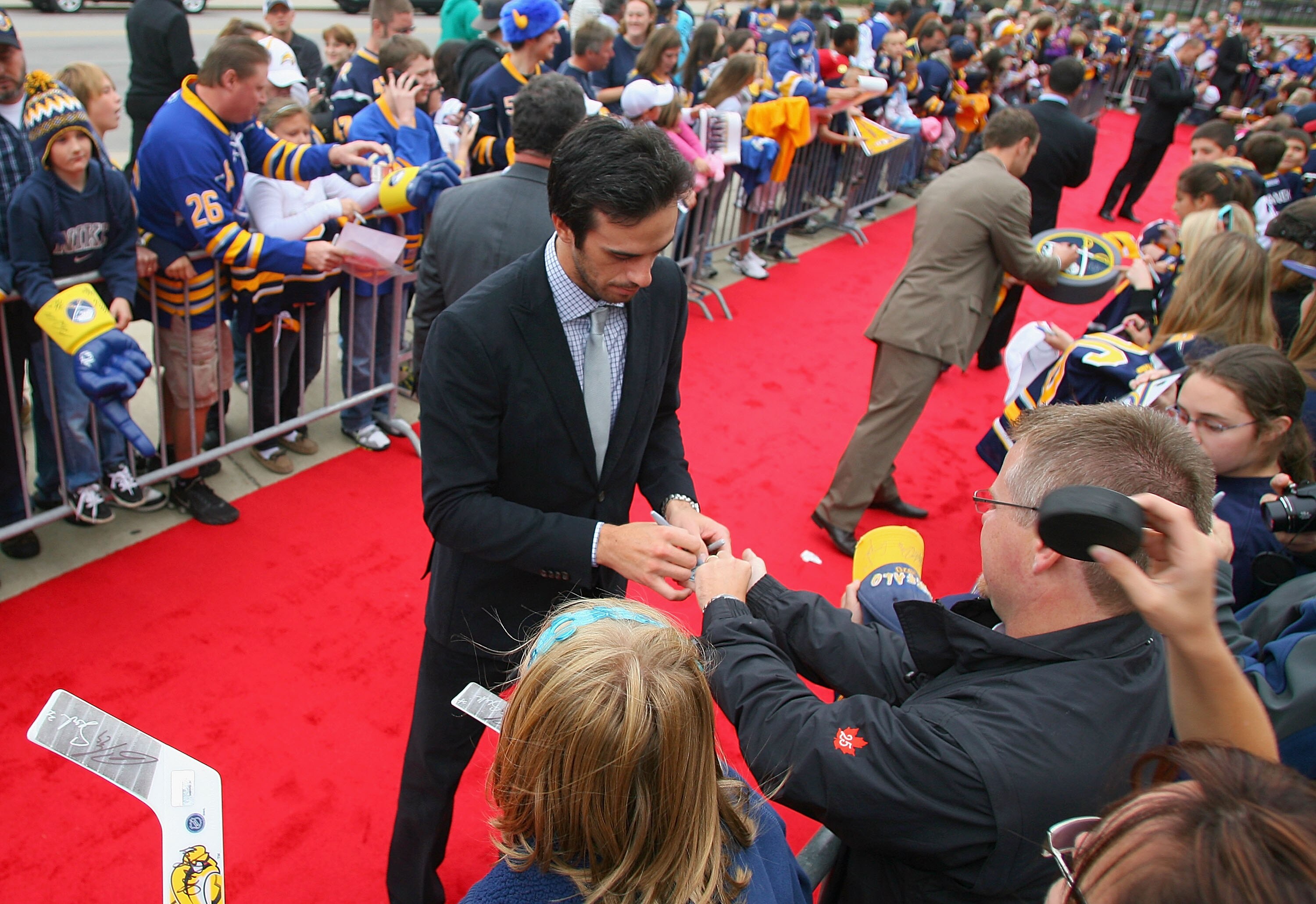 BUFFALO, NY - SEPTEMBER 25:  Ryan Miller of the Buffalo Sabres sighns autographs for fans during a red carpet arrival for the players prior to playing the Toronto Maple Leafs at HSBC Arena on September 25, 2010 in Buffalo, New York.  (Photo by Rick Stewar