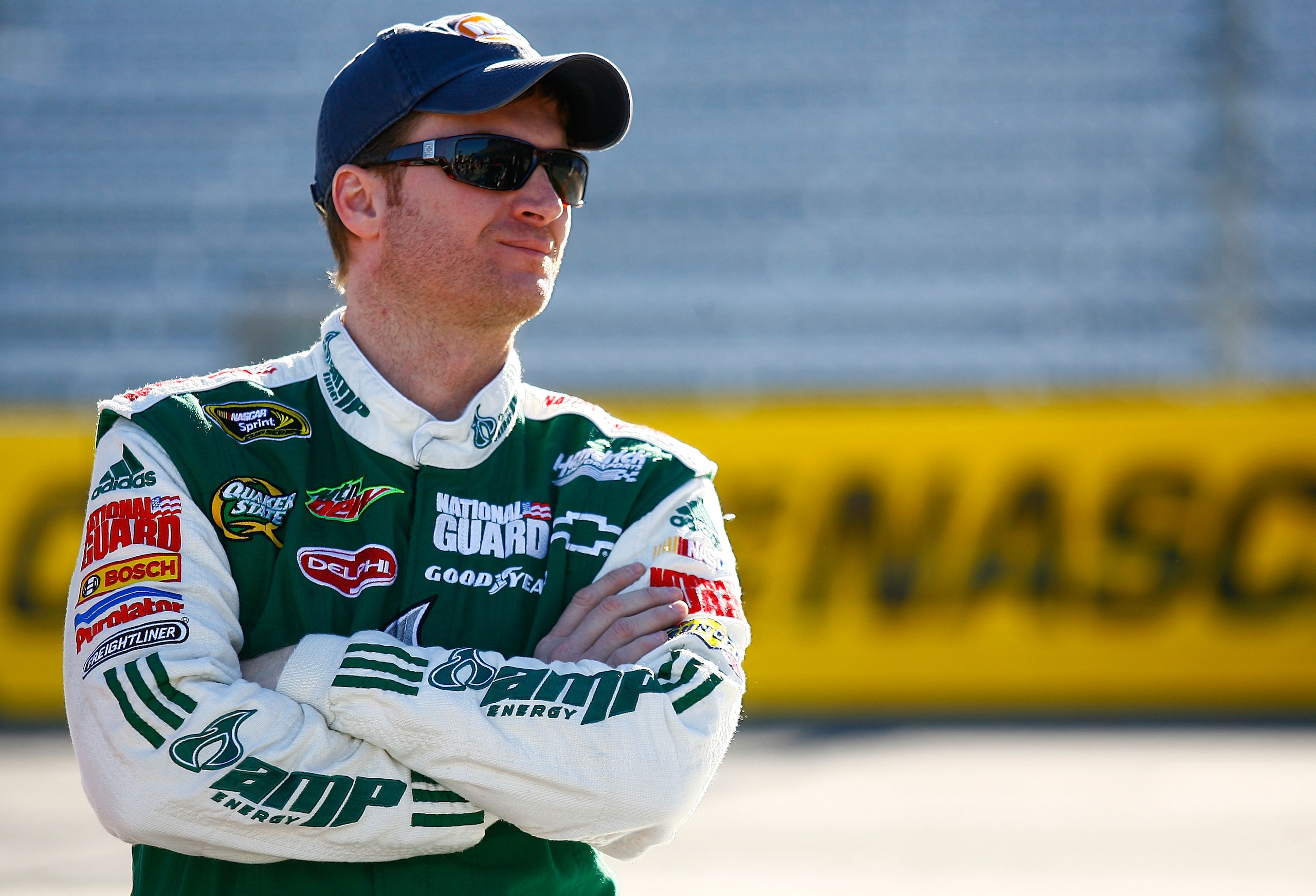 MARTINSVILLE, VA - OCTOBER 22:  Dale Earnhardt Jr., driver of the #88 AMP Energy/National Guard Chevrolet, stands on pit road during qualifying for the NASCAR Sprint Cup Series TUMS Fast Relief 500 at Martinsville Speedway on October 22, 2010 in Martinsvi