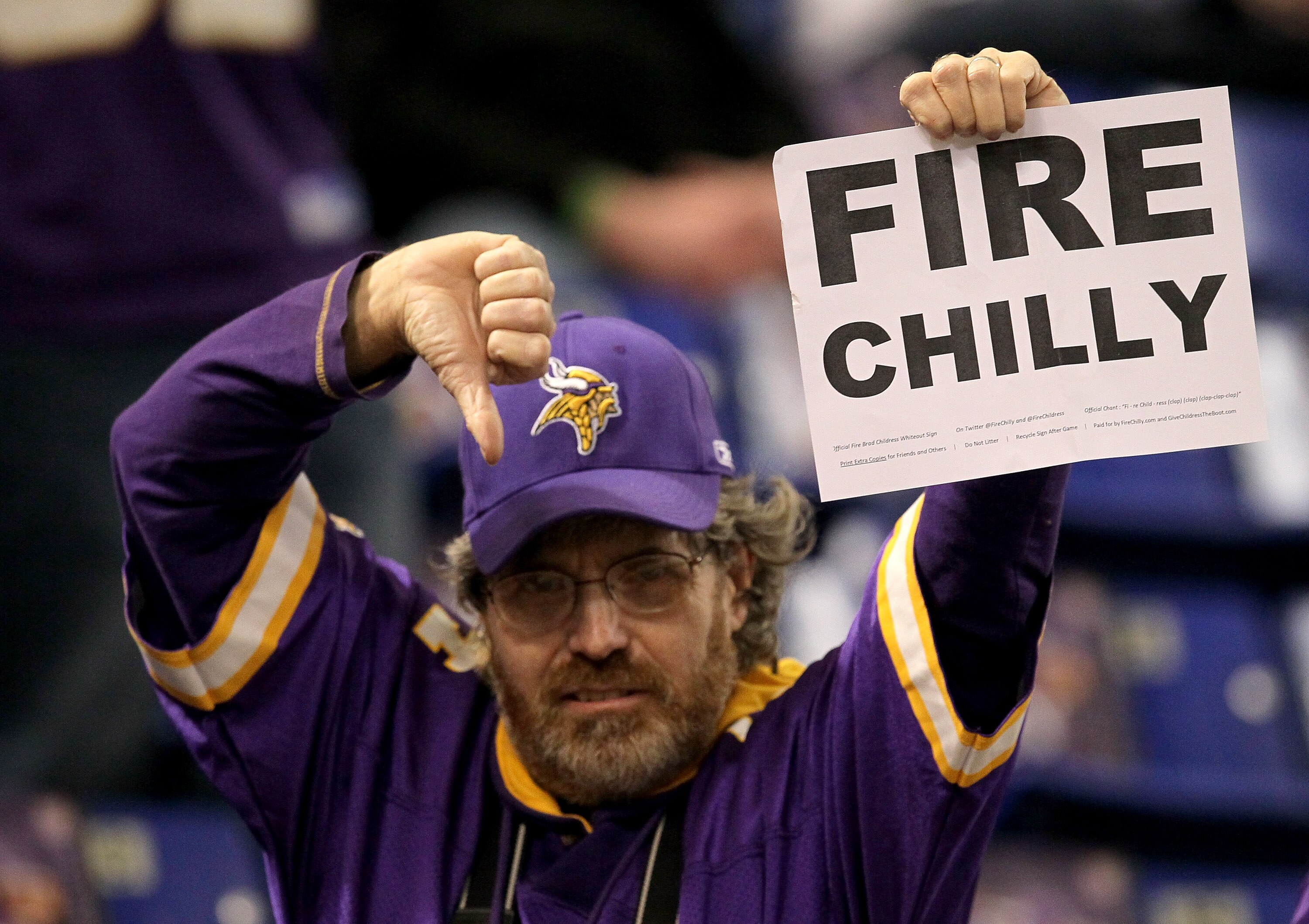 MINNEAPOLIS - NOVEMBER 07:  A Minnesota Vikings fan holds up a sign urging the firing of Vikings head coach rad Childress before the game with the Arizona Cardinals at Hubert H. Humphrey Metrodome on November 7, 2010 in Minneapolis, Minnesota.  (Photo by 