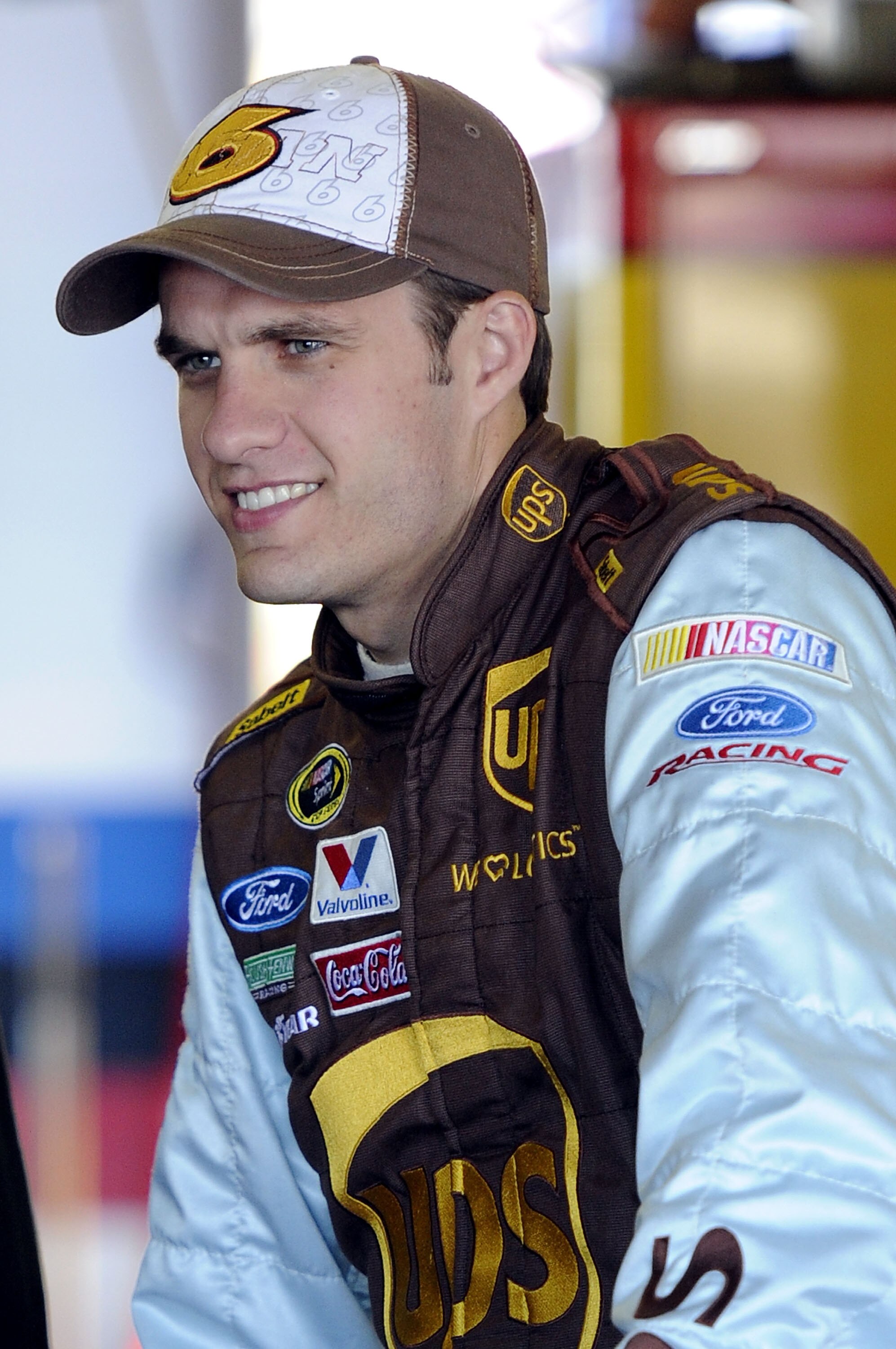 TALLADEGA, AL - OCTOBER 29:  David Ragan, driver of the #6 UPS Ford, stands in the garage during practice for the NASCAR Sprint Cup Series AMP Energy Juice 500 at Talladega Superspeedway on October 29, 2010 in Talladega, Alabama.  (Photo by John Harrelson