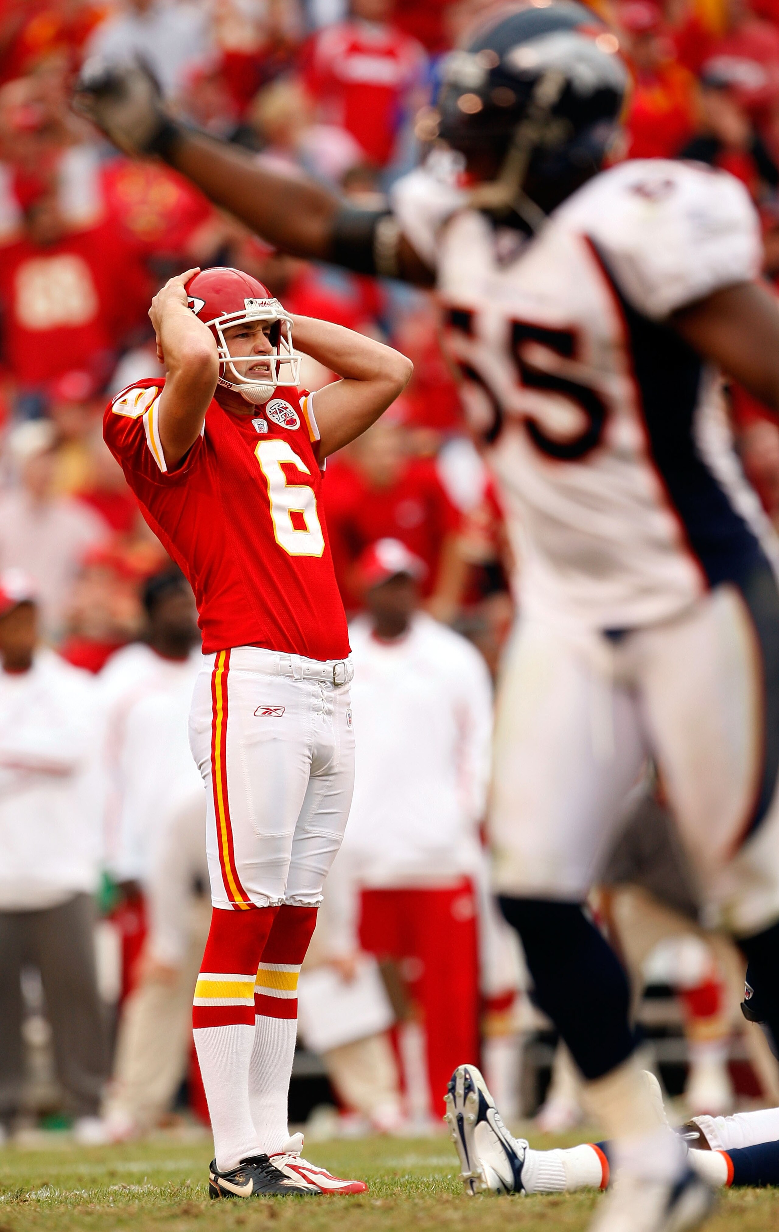 KANSAS CITY, MO - NOVEMBER 11: Kicker Dave Rayner #6 of the Kansas City Chiefs reacts after missing a field goal as D.J. Williams #55 of the Denver Broncos celebrates during the second half of the game on November 11, 2007 at Arrowhead Stadium in Kansas KANSAS CITY, MO - NOVEMBER 11: Kicker Dave Rayner #6 of the Kansas City Chiefs reacts after missing a field goal as D.J. Williams #55 of the Denver Broncos celebrates during the second half of the game on November 11, 2007 at Arrowhead Stadium in Kansas