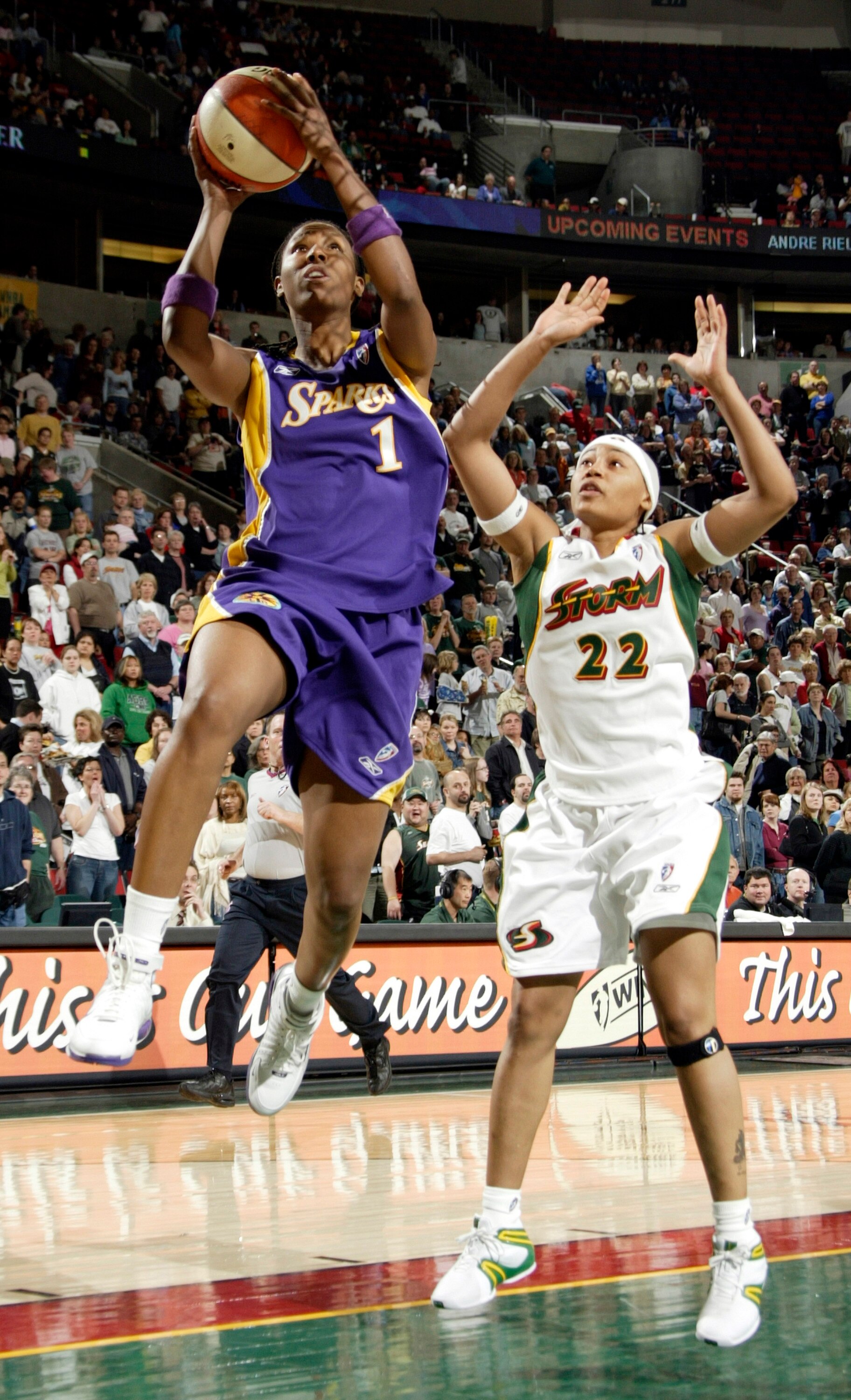 SEATTLE - MAY 21:  Chamique Holdsclaw #1 of the Los Angeles Sparks shoots against Betty Lennox #22 of the Seattle Storm at Key Arena on May 21, 2005 in Seattle, Washington. NOTE TO USER: User expressly acknowledges and agrees that, by downloading and/or u