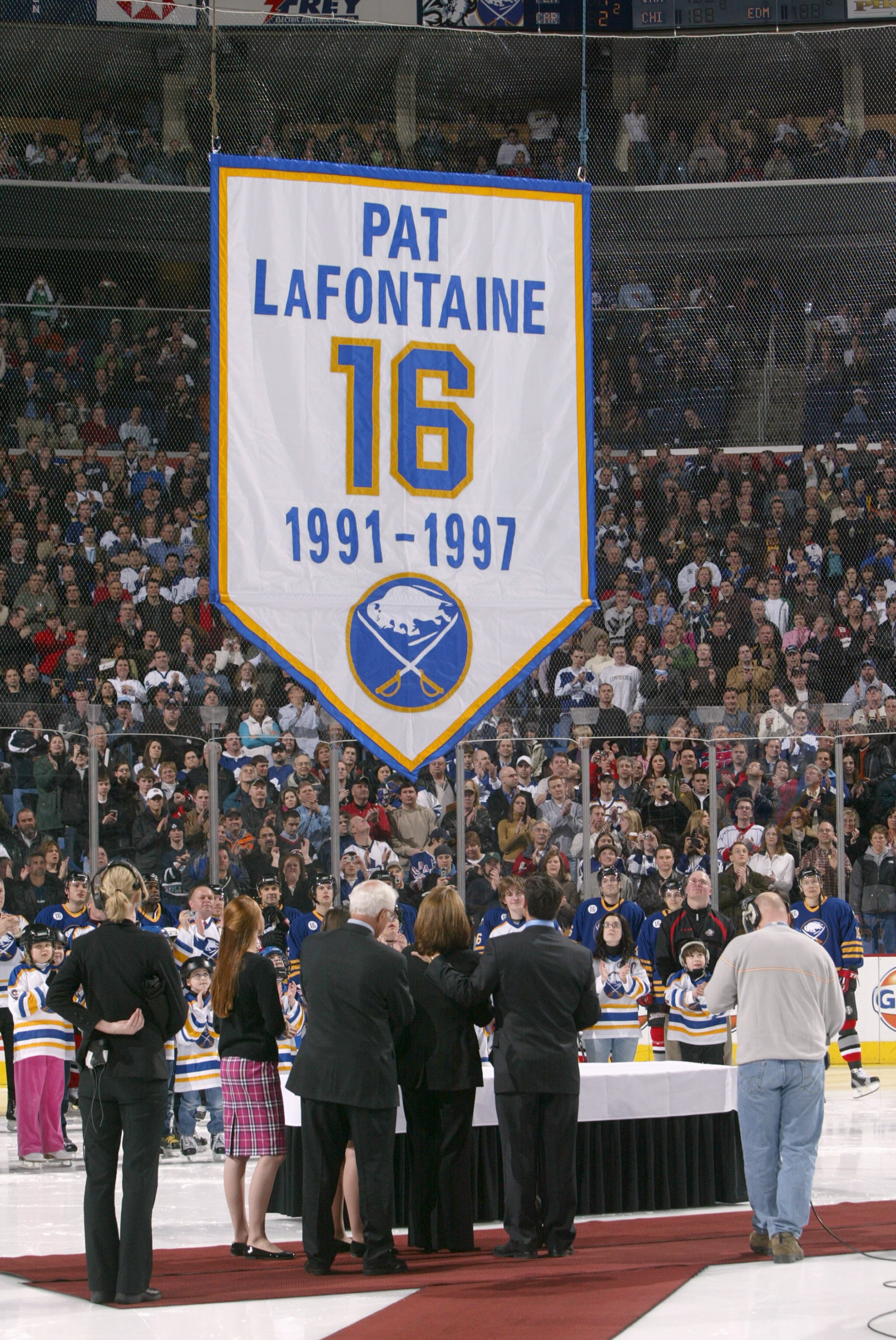 BUFFALO, NY - MARCH 3: Pat LaFontaine and his family watch as his jersey is raised to the rafters during a ceremony to retire his #16 with the Buffalo Sabres before their game against the Toronto Maple Leafs at HSBC Arena March 3, 2006 in Buffalo, New Yor
