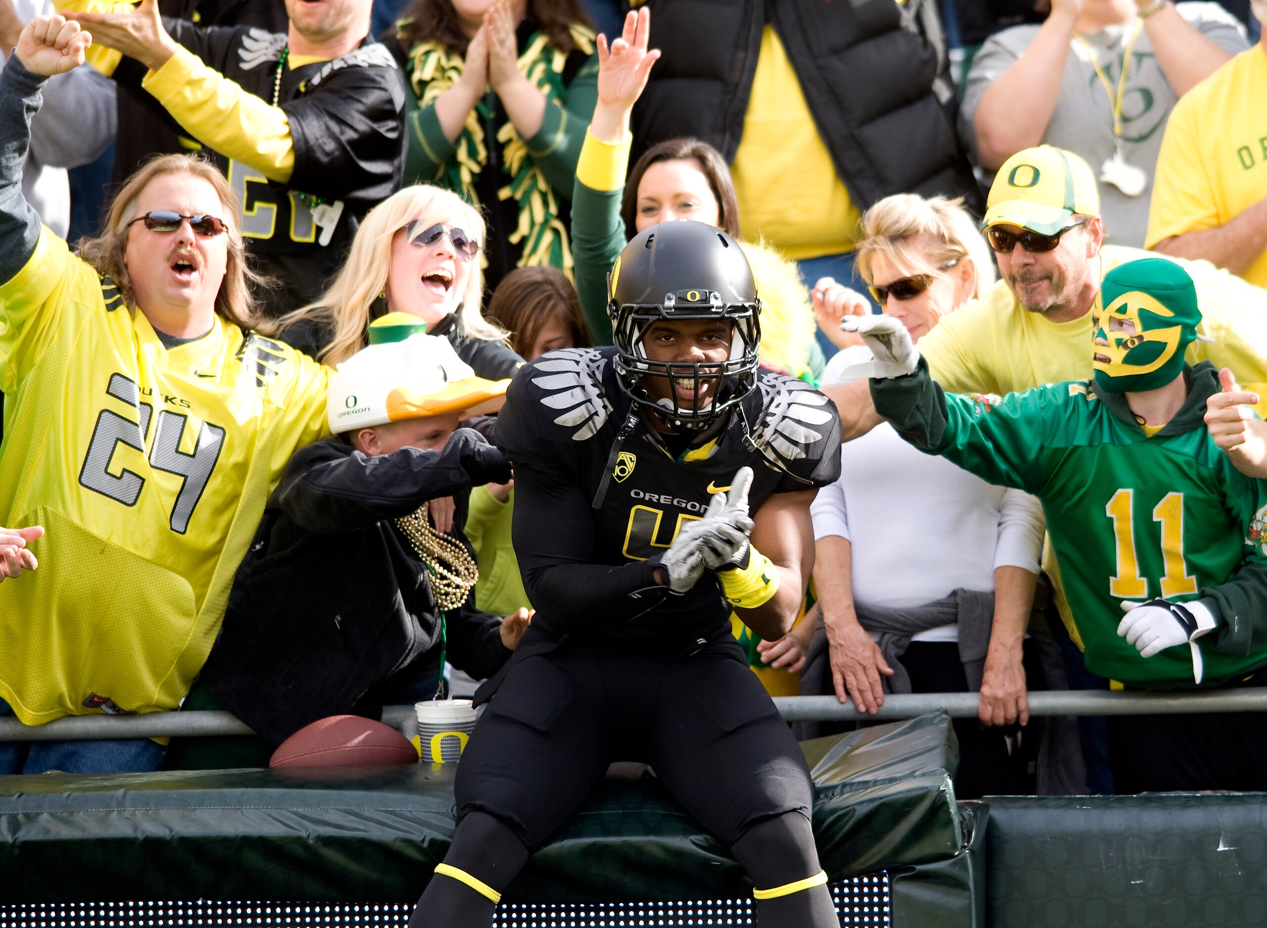 EUGENE, OR - NOVEMBER 6: Wide receiver Josh Huff #4 of the Oregon Ducks jumps into the crowd during the team introductions before the game against the Washington Huskies at Autzen Stadium on November 6, 2010 in Eugene, Oregon. The Ducks won the game 53-16