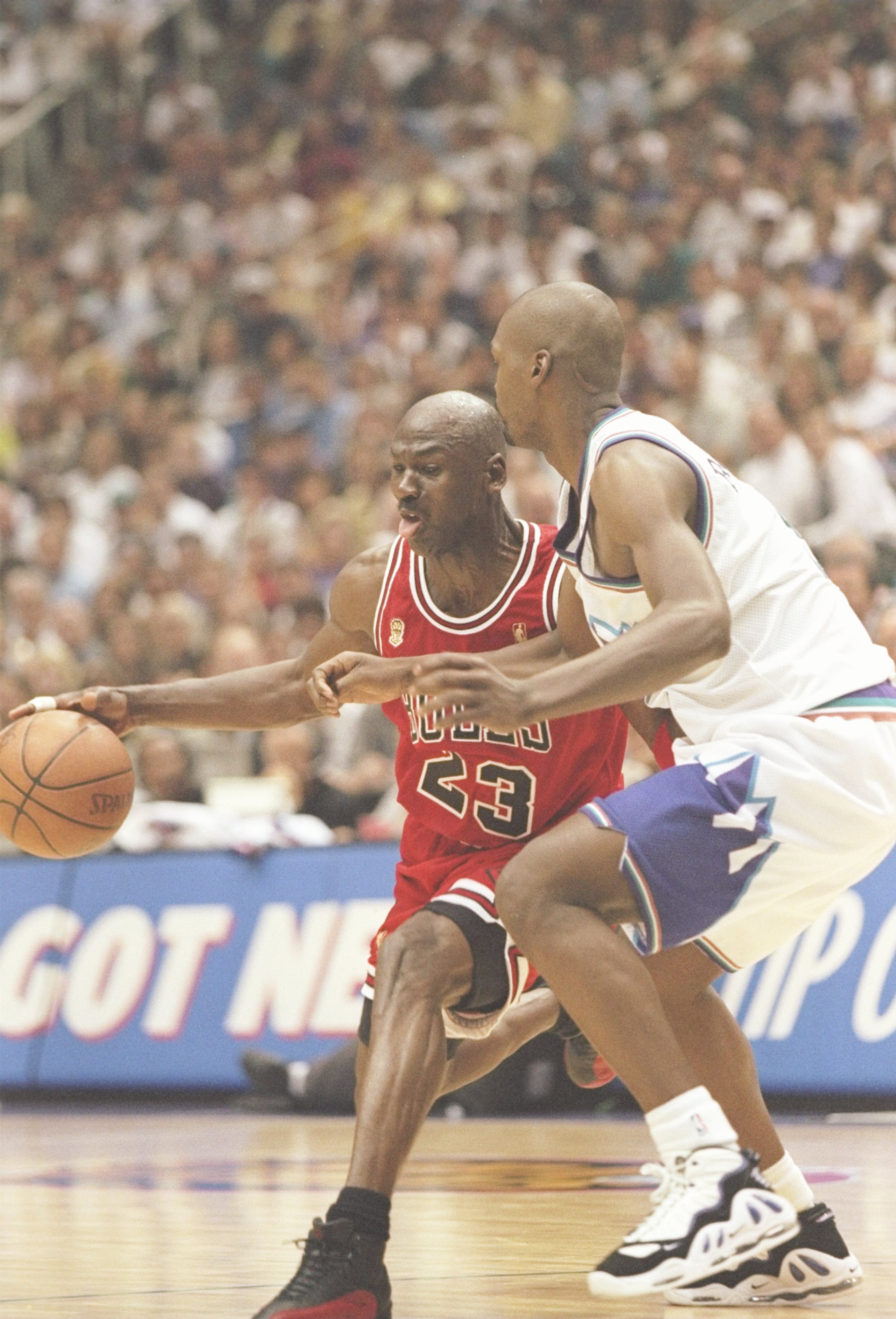 11 Jun 1997:  Guard Michael Jordan of the Chicago Bulls tries to drive past forward Bryon Russell of the Utah Jazz during a playoff game at the Delta Center in Salt Lake City, Utah.  The Bulls won the game 90-88. Mandatory Credit: Brian Bahr  /Allsport