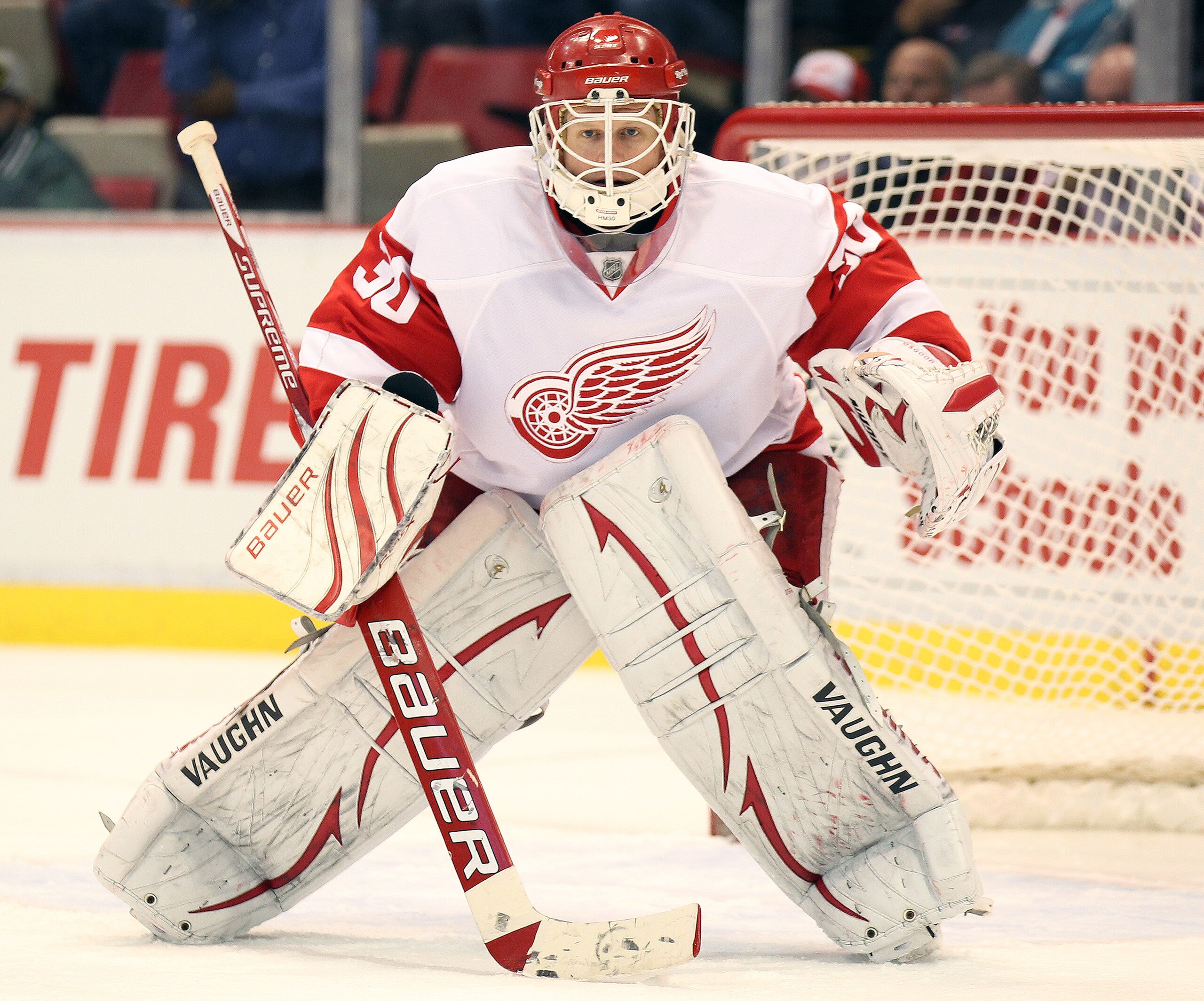 DETROIT - OCTOBER 30:  Chris Osgood #30 of the Detroit Red Wings keeps an eye on the play in a game against the Nashville Predators on October 30,2010 at the Joe Louis Arena in Detroit , Michigan. The Wings defeated the Predators 5-2. (Photo by Claus Ande