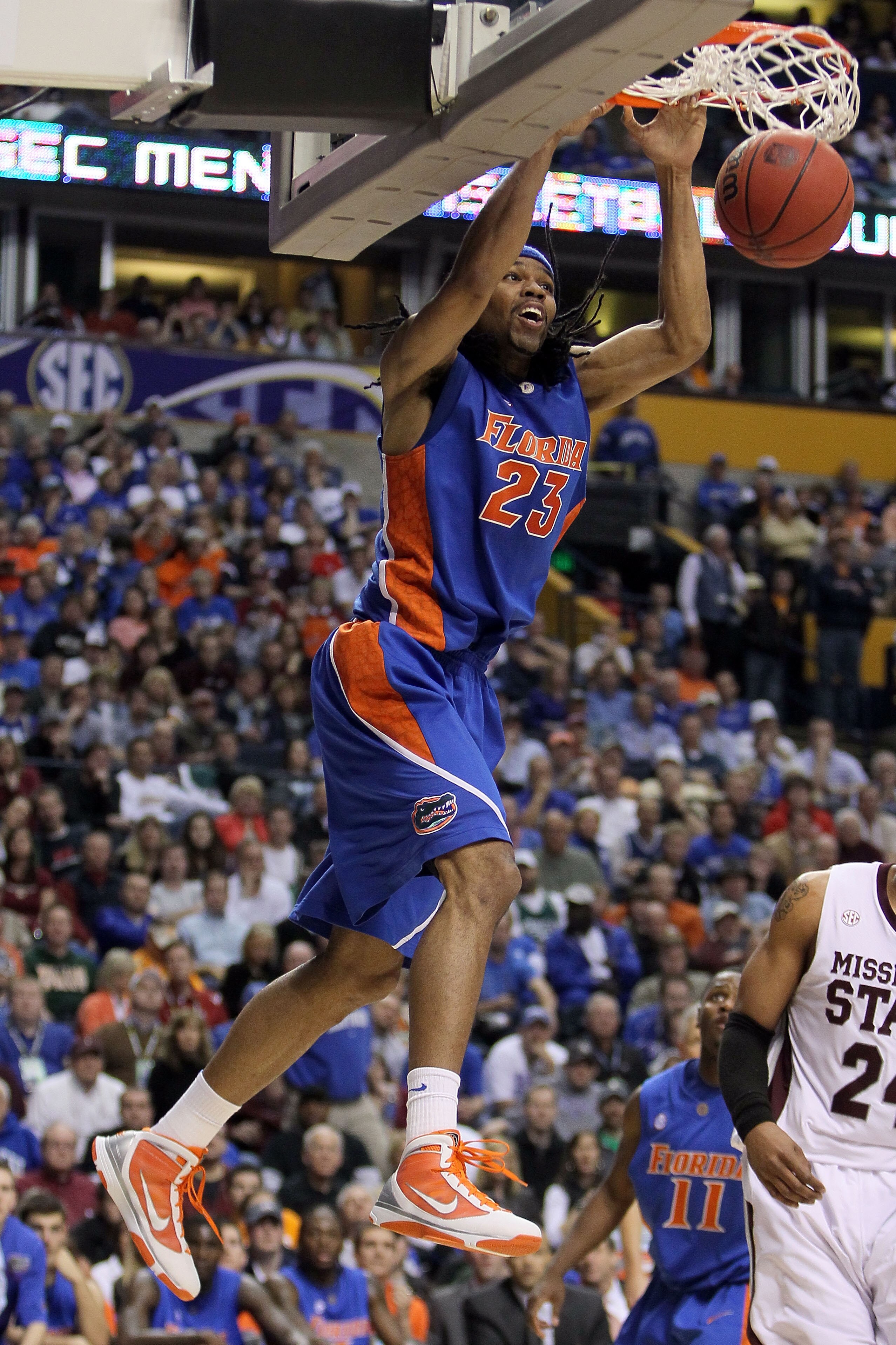 NASHVILLE, TN - MARCH 12:  Alex Tyus #23 of  the Florida Gators dunks against the Mississippi State Bulldogs during the quarterfinals of the SEC Men's Basketball Tournament at the Bridgestone Arena on March 12, 2010 in Nashville, Tennessee.  (Photo by And