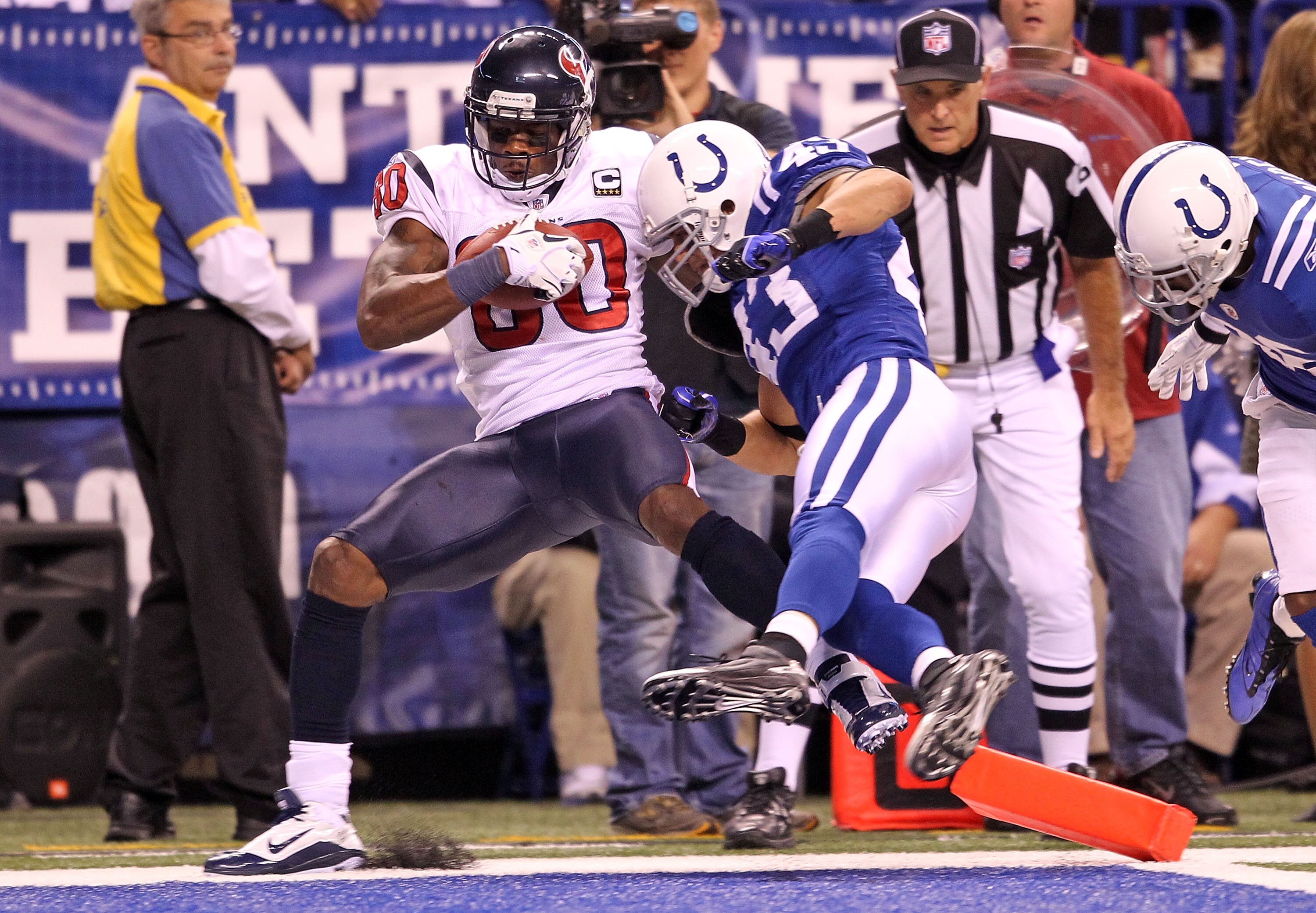 INDIANAPOLIS - NOVEMBER 01:  Andre Johnson #80 of Houston Texans scores a touchdown while defeded by Aaron Francisco #43 of the Indianapolis Colts at Lucas Oil Stadium on November 1, 2010 in Indianapolis, Indiana.  (Photo by Andy Lyons/Getty Images)