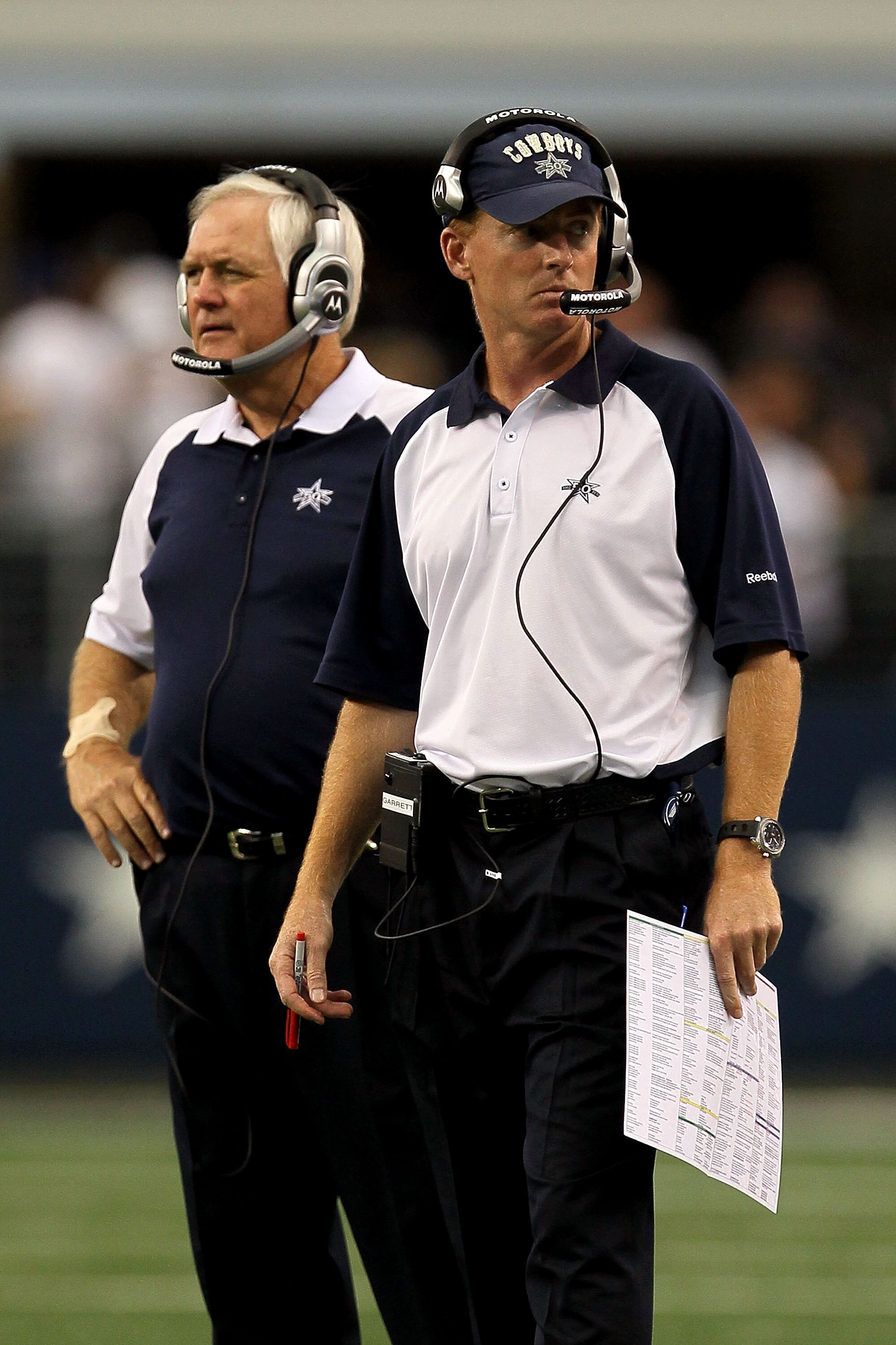 ARLINGTON, TX - OCTOBER 31:  (L-R) Head coach Wade Phillips and assistant head coach/offensive coordinator Jason Garrett of the Dallas Cowboys look on against the Jacksonville Jaguars at Cowboys Stadium on October 31, 2010 in Arlington, Texas.  (Photo by