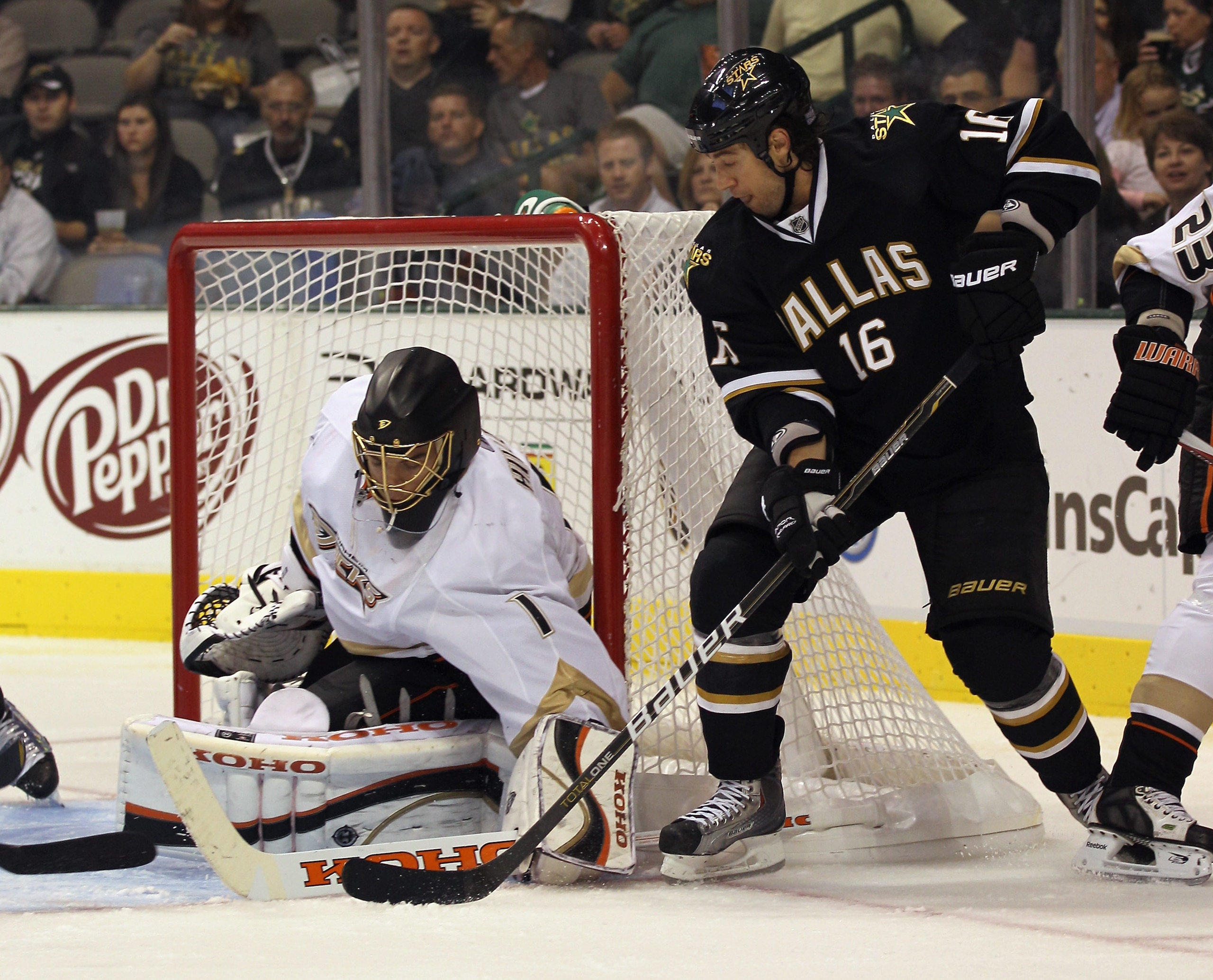 DALLAS - OCTOBER 26: Jonas Hiller #1 of the Anaheim Ducks stops Adam Burish #16 of the Dallas Stars at the American Airlines Center on October 26, 2010 in Dallas, Texas. (Photo by Bruce Bennett/Getty Images) DALLAS - OCTOBER 26: Jonas Hiller #1 of the Anaheim Ducks stops Adam Burish #16 of the Dallas Stars at the American Airlines Center on October 26, 2010 in Dallas, Texas. (Photo by Bruce Bennett/Getty Images)