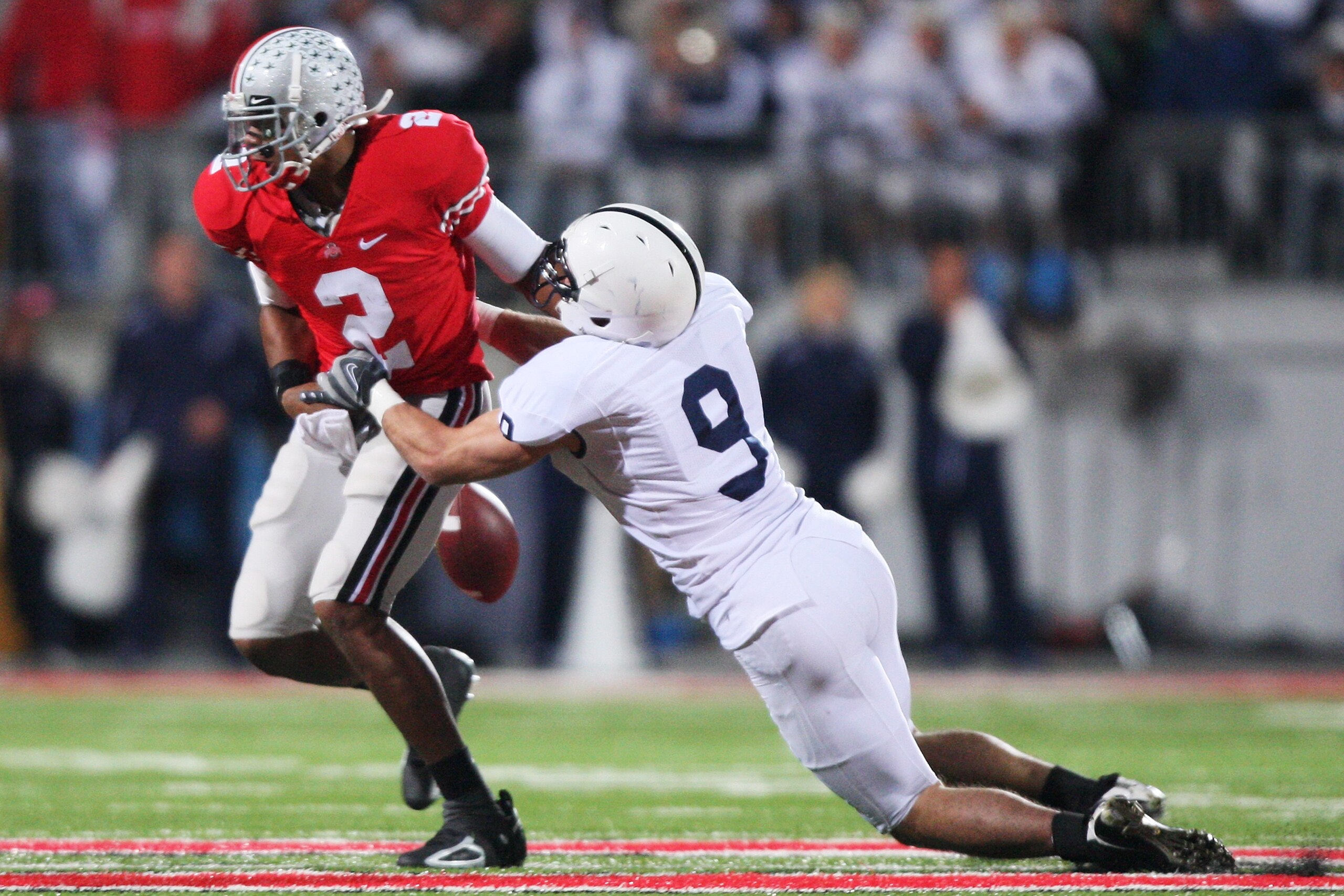 COLUMBUS, OH - OCTOBER 25: Quarterback Terrell Pryor #2 of the Ohio State Buckeyes fumbles the ball after being hit by defensive back Mark Rubin #9 of the Penn State Nittany Lions on October 25, 2008 at Ohio Stadium in Columbus, Ohio. Penn State recovered