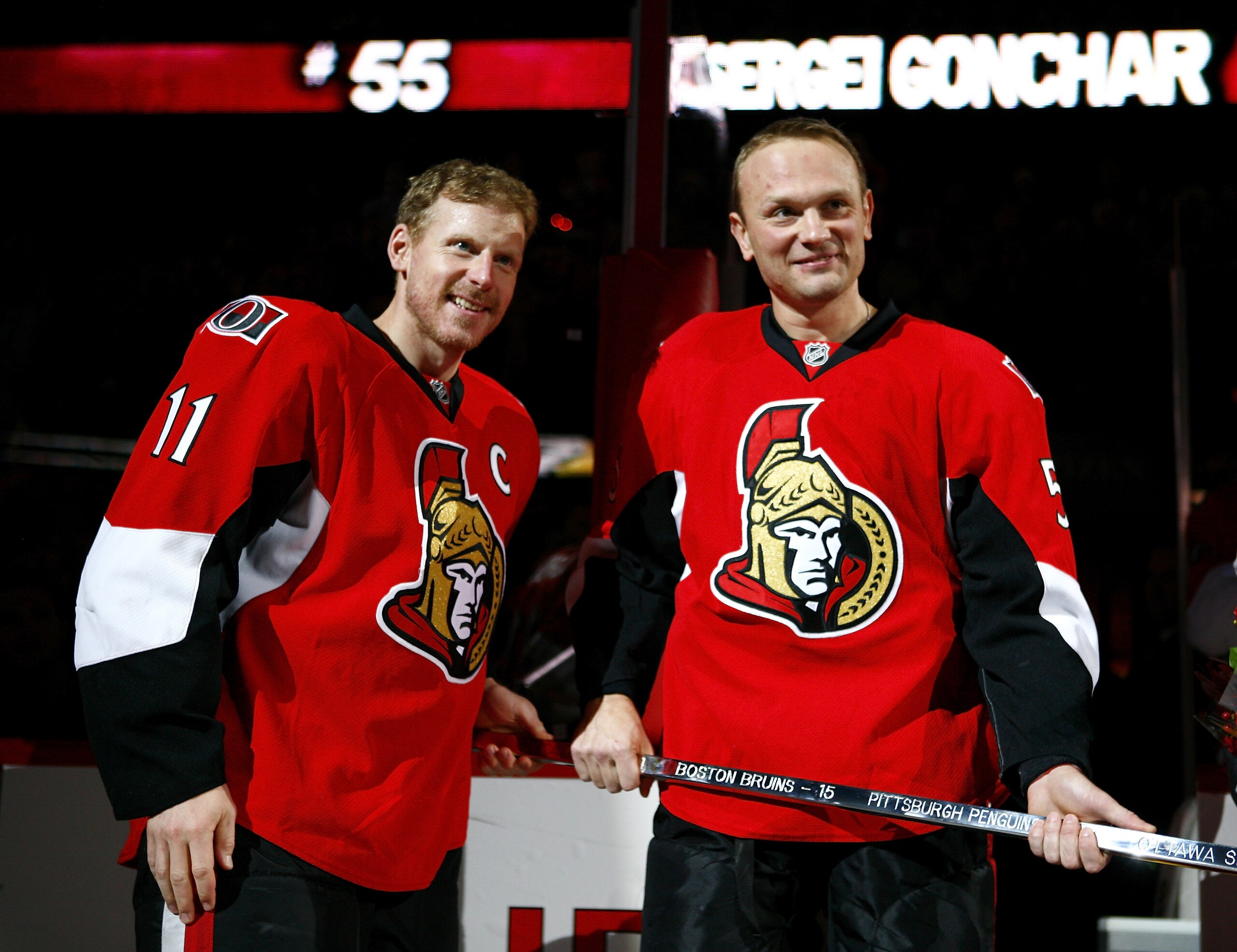 OTTAWA, ON - OCTOBER 26: In honour of his 1000th NHL regular season game Daniel Alfredsson #11 of the Ottawa Senators presents the traditional silver stick to Sergei Gonchar #55 before a game against the Phoenix Coyotes at Scotiabank Place on October 26 OTTAWA, ON - OCTOBER 26: In honour of his 1000th NHL regular season game Daniel Alfredsson #11 of the Ottawa Senators presents the traditional silver stick to Sergei Gonchar #55 before a game against the Phoenix Coyotes at Scotiabank Place on October 26