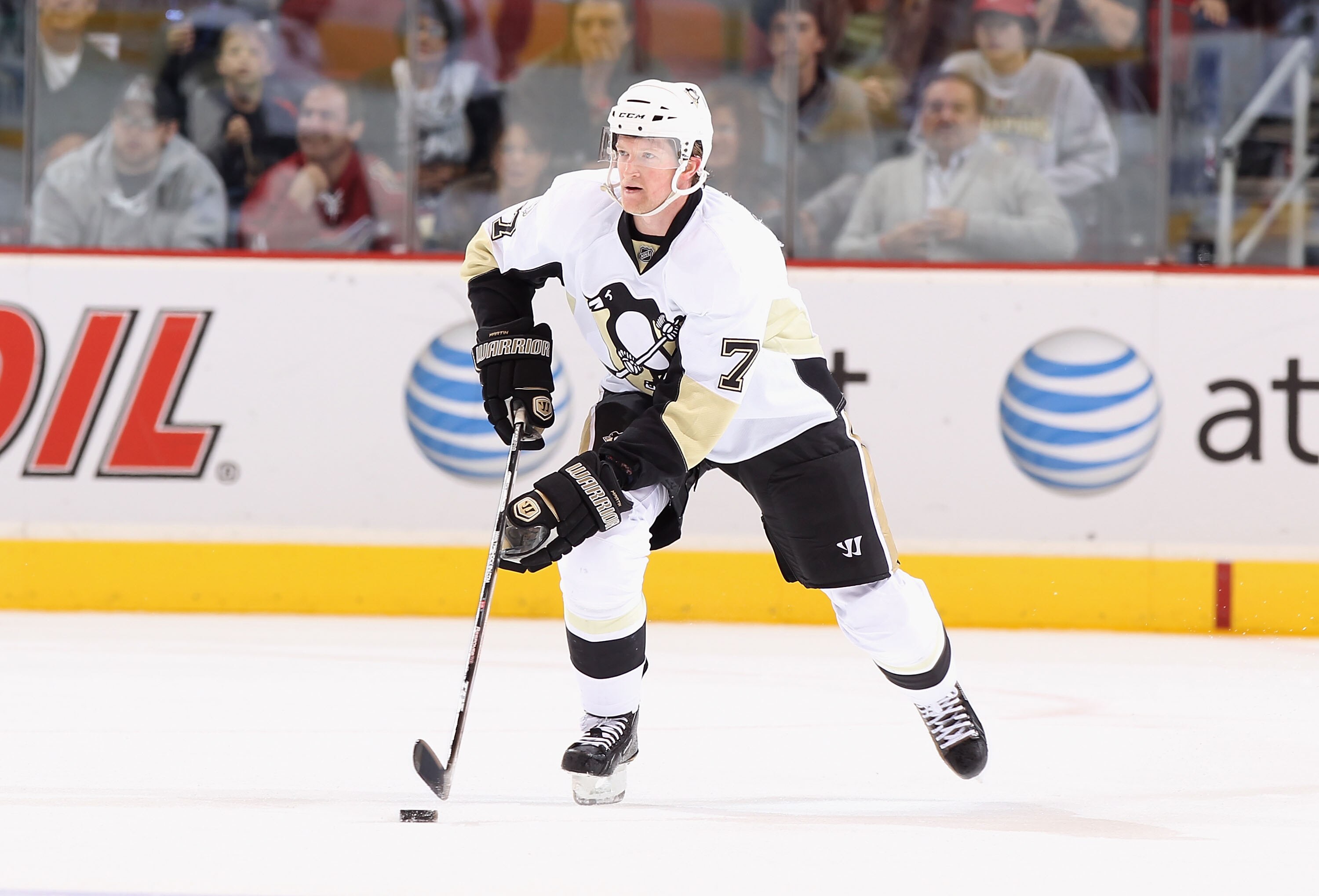 GLENDALE, AZ - NOVEMBER 06:  Paul Martin #7 of the Pittsburgh Penguins skates with the puck during the NHL game against the Phoenix Coyotes at Jobing.com Arena on November 6, 2010 in Glendale, Arizona.  The Penguins defeated the Coyotes 4-3 in an overtime