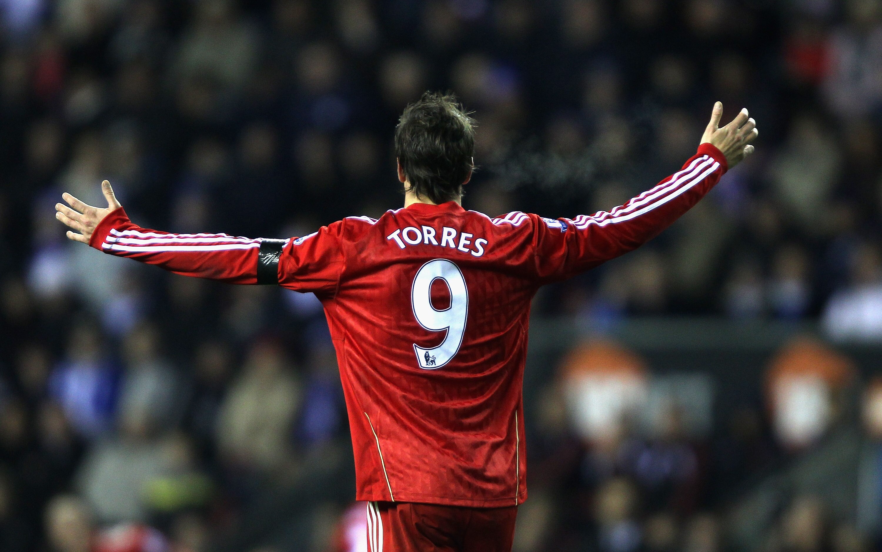 WIGAN, ENGLAND - NOVEMBER 10:  Fernando Torres  of Liverpool puts his arms up in frustration during the Barclays Premier League match between Wigan Athletic and Liverpool at DW Stadium on November 10, 2010 in Wigan, England.  (Photo by Clive Brunskill/Get