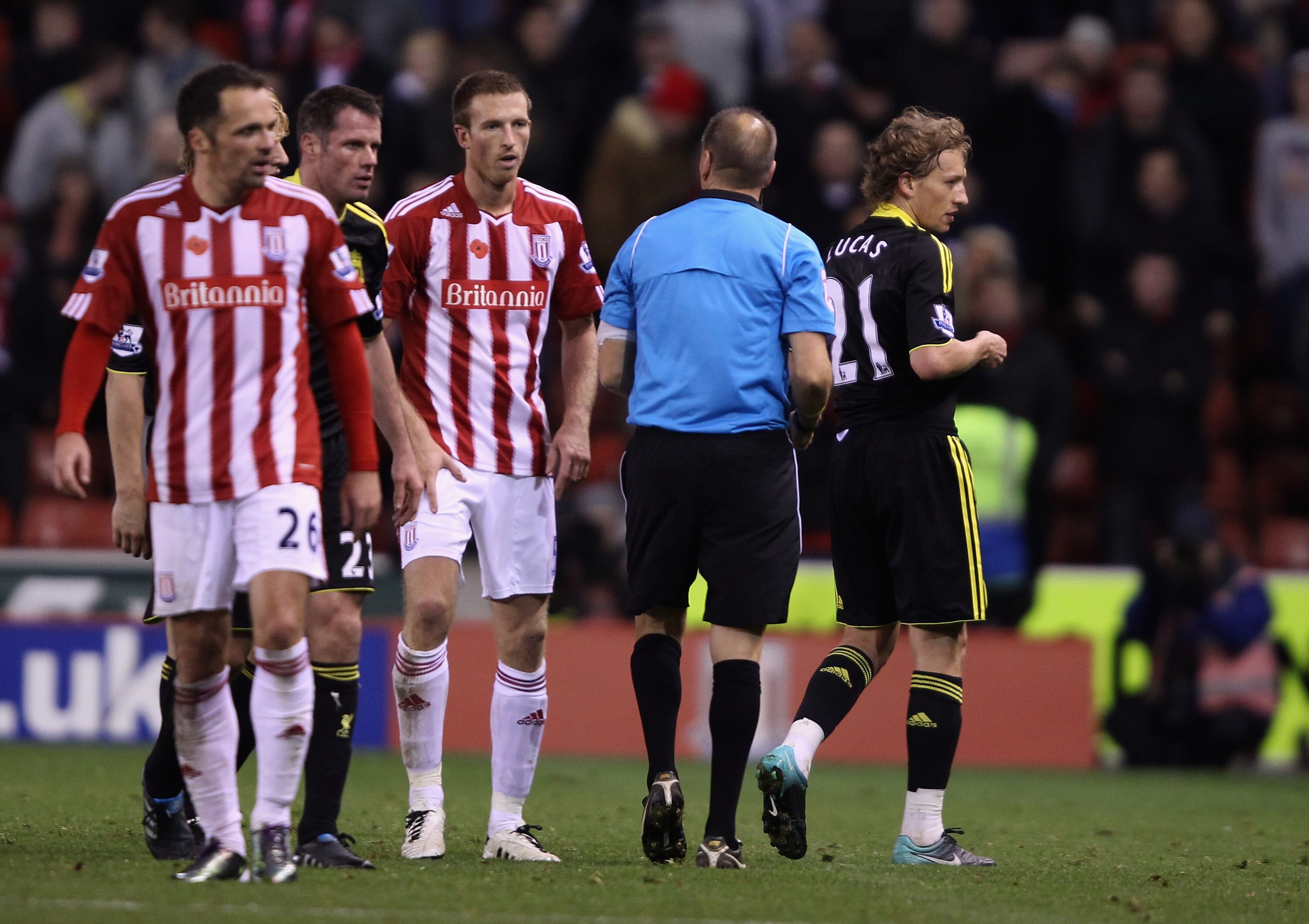 STOKE ON TRENT, ENGLAND - NOVEMBER 13: Lucas  of Liverpool walks off the pitch after being shown the red card by referee Mr M Halsey during the Barclays Premier League match between Stoke City and Liverpool at Britannia Stadium on November 13, 2010 in Sto