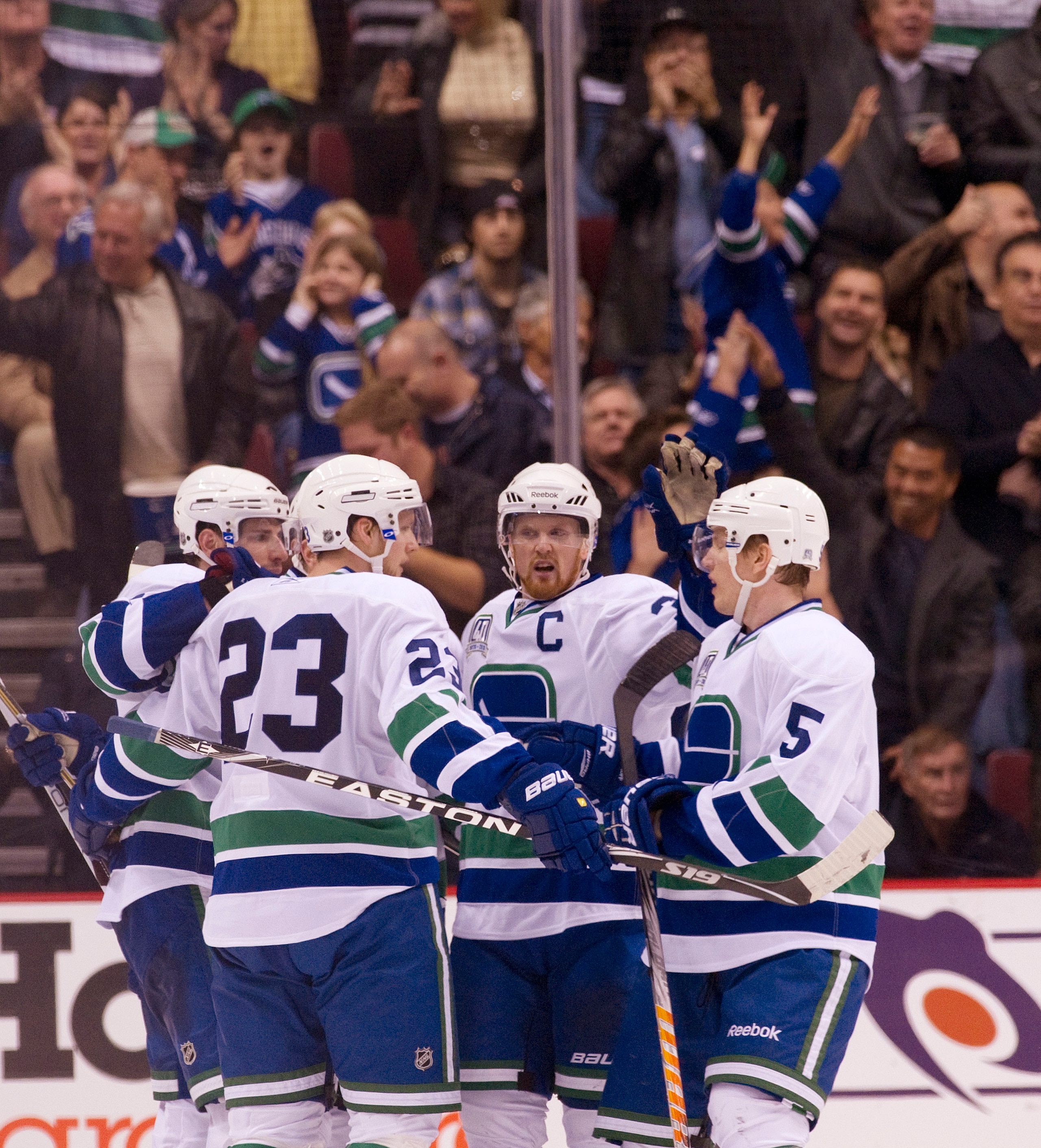 VANCOUVER, CANADA - NOVEMBER 6: Alexander Edler #23 of the Vancouver Canucks celebrates with Ryan Kesler #17, Henrik Sedin #33 and Christian Ehrhoff #5 after scoring what proved to be the game winning goal against the Detroit Red Wings during the third pe