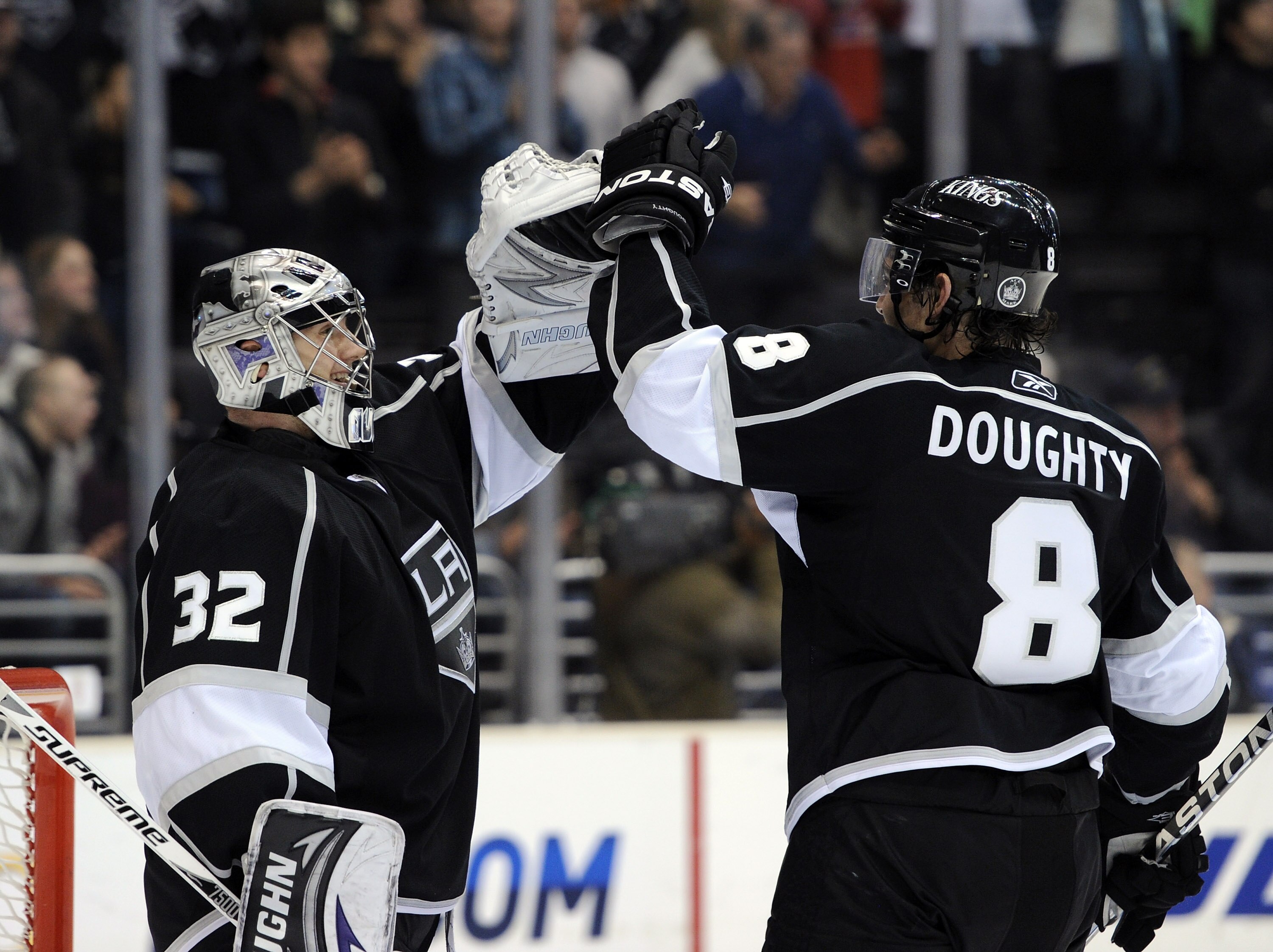 LOS ANGELES, CA - NOVEMBER 11:  Jonathan Quick #32 and Drew Doughty #8 of the Los Angeles Kings celebrates a 3-1 win over the Dallas Stars at the Staples Center on November 11, 2010 in Los Angeles, California.  (Photo by Harry How/Getty Images)