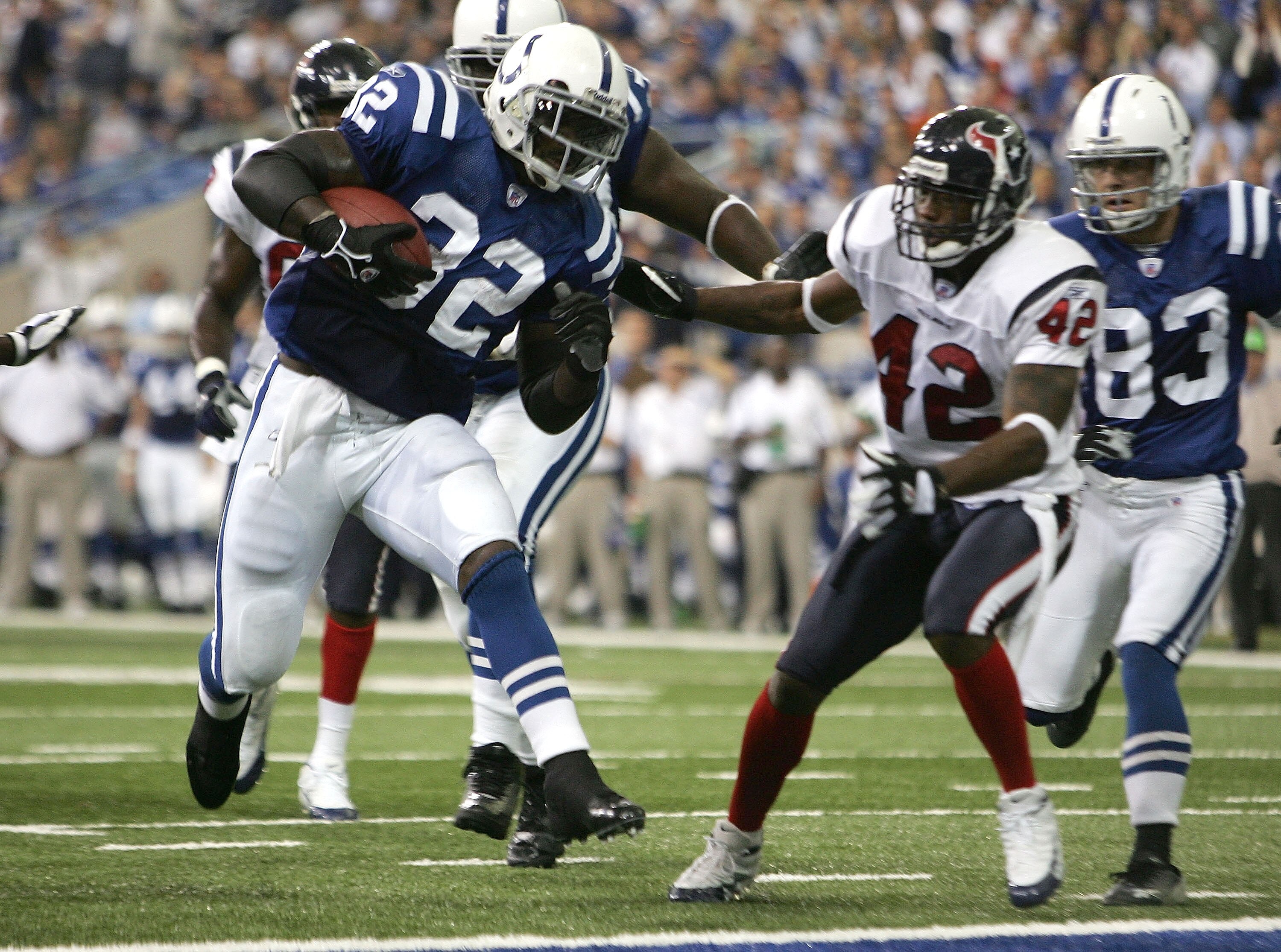 INDIANAPOLIS - NOVEMBER 13:  Edgerrin James #32 of the Indianapolis Colts carries the ball for a touchdown as Marcus Coleman #42 of the Houston Texans looks on, on November 13, 2005 at the RCA Dome in Indianapolis, Indiana.  (Photo by Elsa/Getty Images)