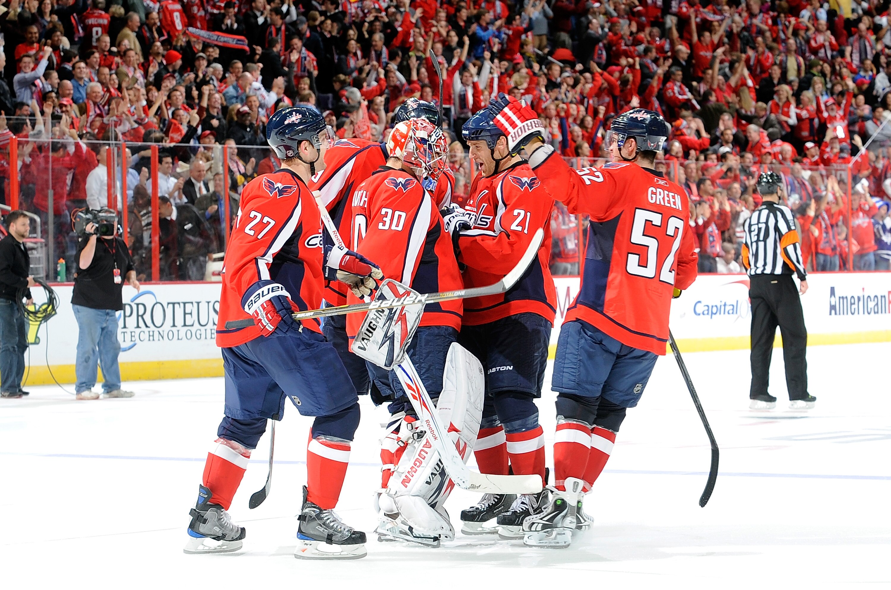 WASHINGTON - NOVEMBER 03:  Michal Neuvirth #30 of the Washington Capitals is congratulted by teammates after the Capitals 5-4 shootout victory against the Toronto Maple Leafs at the Verizon Center on November 3, 2010 in Washington, DC.  (Photo by Greg Fiu