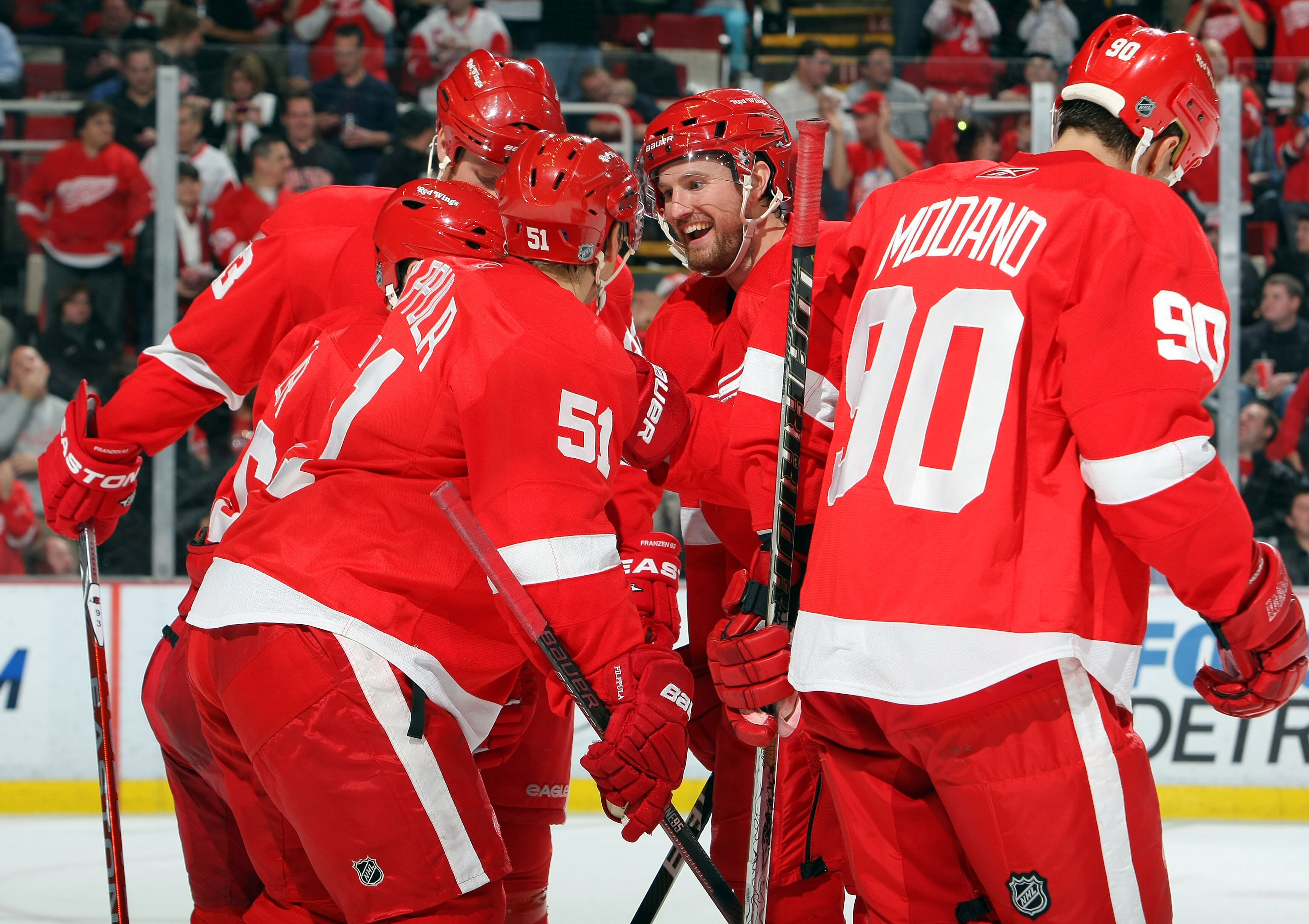 DETROIT - NOVEMBER 11:  Niklas Kronwall #55 (center) of the Detroit Red Wings celebrates a 3rd period goal by his team against the Edmonton Oilers during their NHL game at Joe Louis Arena on November 11, 2010 in Detroit, Michigan.(Photo By Dave Sandford/G