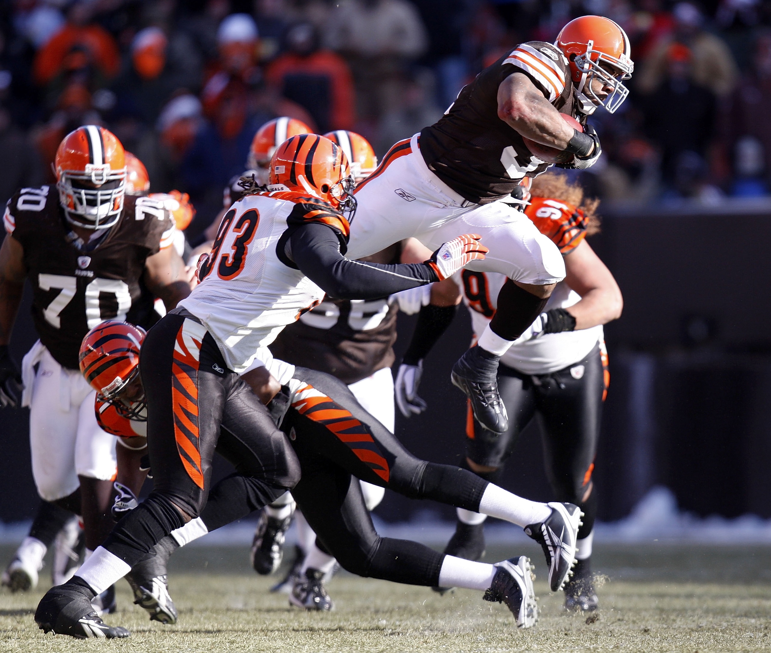 CLEVELAND - DECEMBER 21: Jamal Lewis #31 of the Cleveland Browns jumps over Chinedum Ndukwe #41 of the Cincinnati Bengals for a first quarter first down at Cleveland Browns Stadium December 21, 2008 in Cleveland, Ohio.  (Photo by Gregory Shamus/Getty Imag