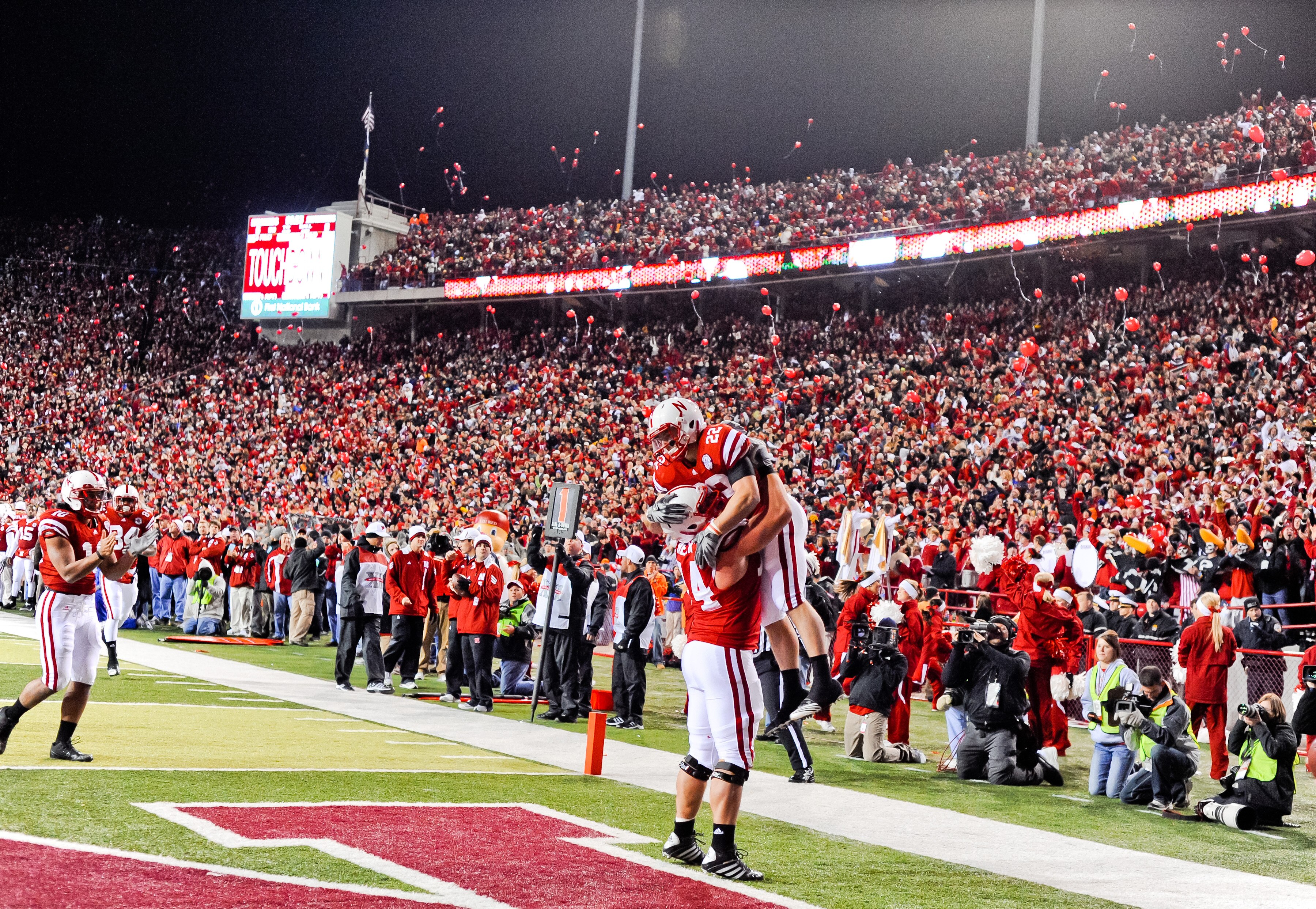 LINCOLN, NE - NOVEMBER 13: Rex Burkhead #22 and Ricky Henry #74 of the Nebraska Cornhuskers celebrate after a touchdown during their game against the Kansas Jayhawks at Memorial Stadium on November 13, 2010 in Lincoln, Nebraska. Nebraska Defeated Kansas 2