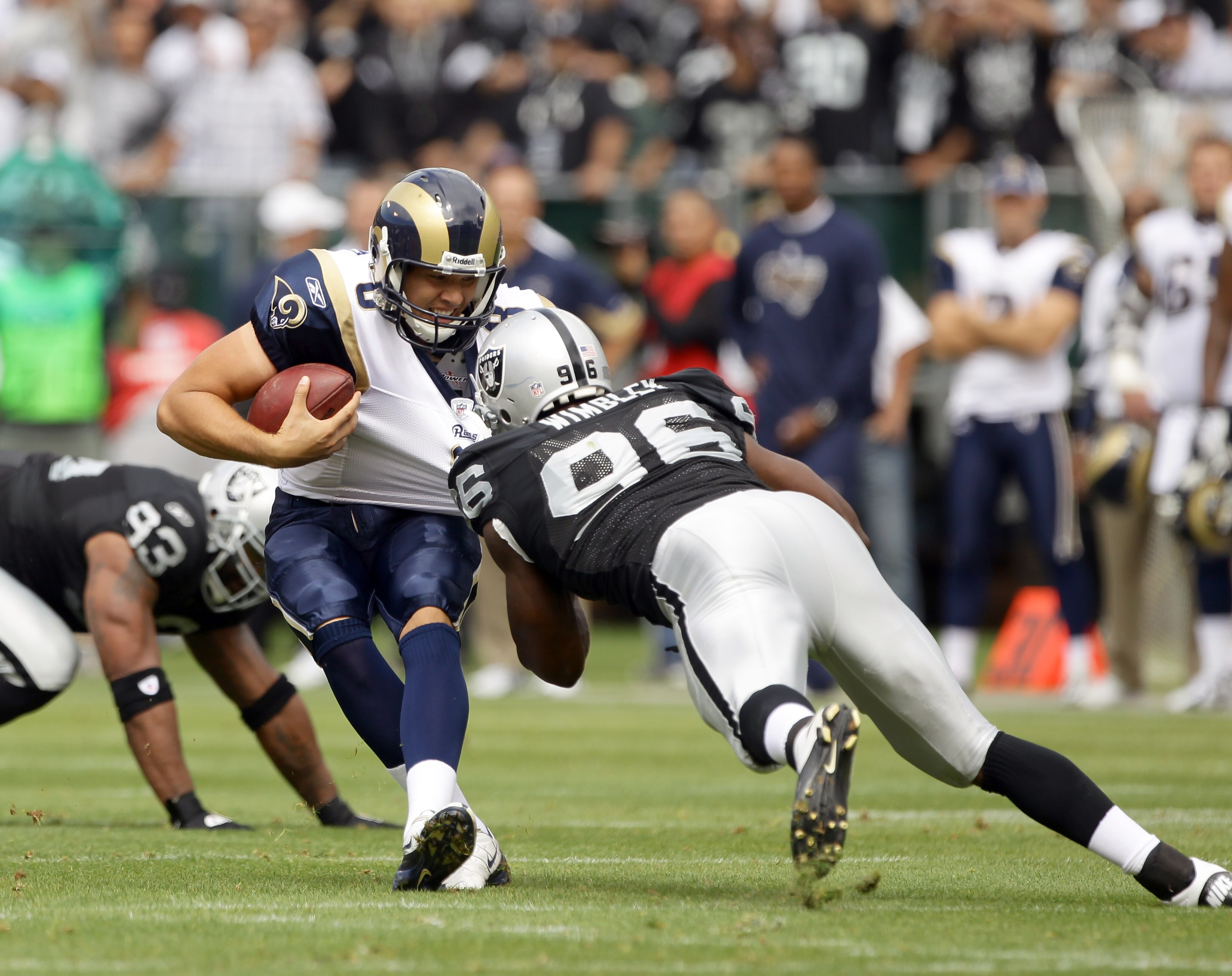 OAKLAND, CA - SEPTEMBER 19:  Sam Bradford #8 of the St. Louis Rams is sacked by Kamerion Wimbley #96 of the Oakland Raiders at the Oakland-Alameda County Coliseum on September 19, 2010 in Oakland, California.  (Photo by Ezra Shaw/Getty Images)