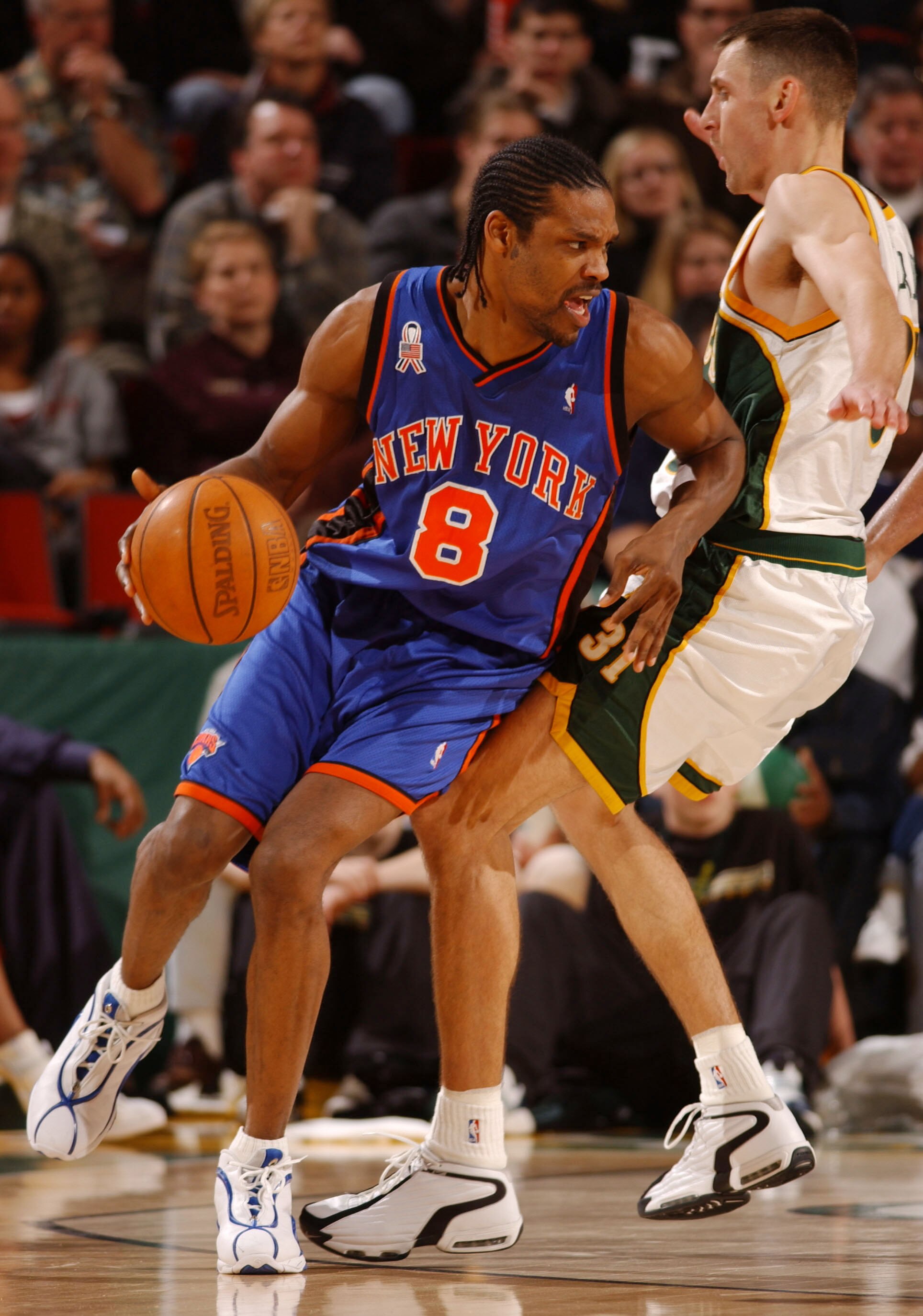 5 APR 2002:  Latrell Sprewell #8 of the New York Knicks is closely defended by Brent Barry #31 of the Seattle Supersonics at Key Arena in Seattle Washington.  The Knicks defeated the Sonics 86-83. Digital Image. DIGITAL IMAGE NOTE TO USER: User expressly