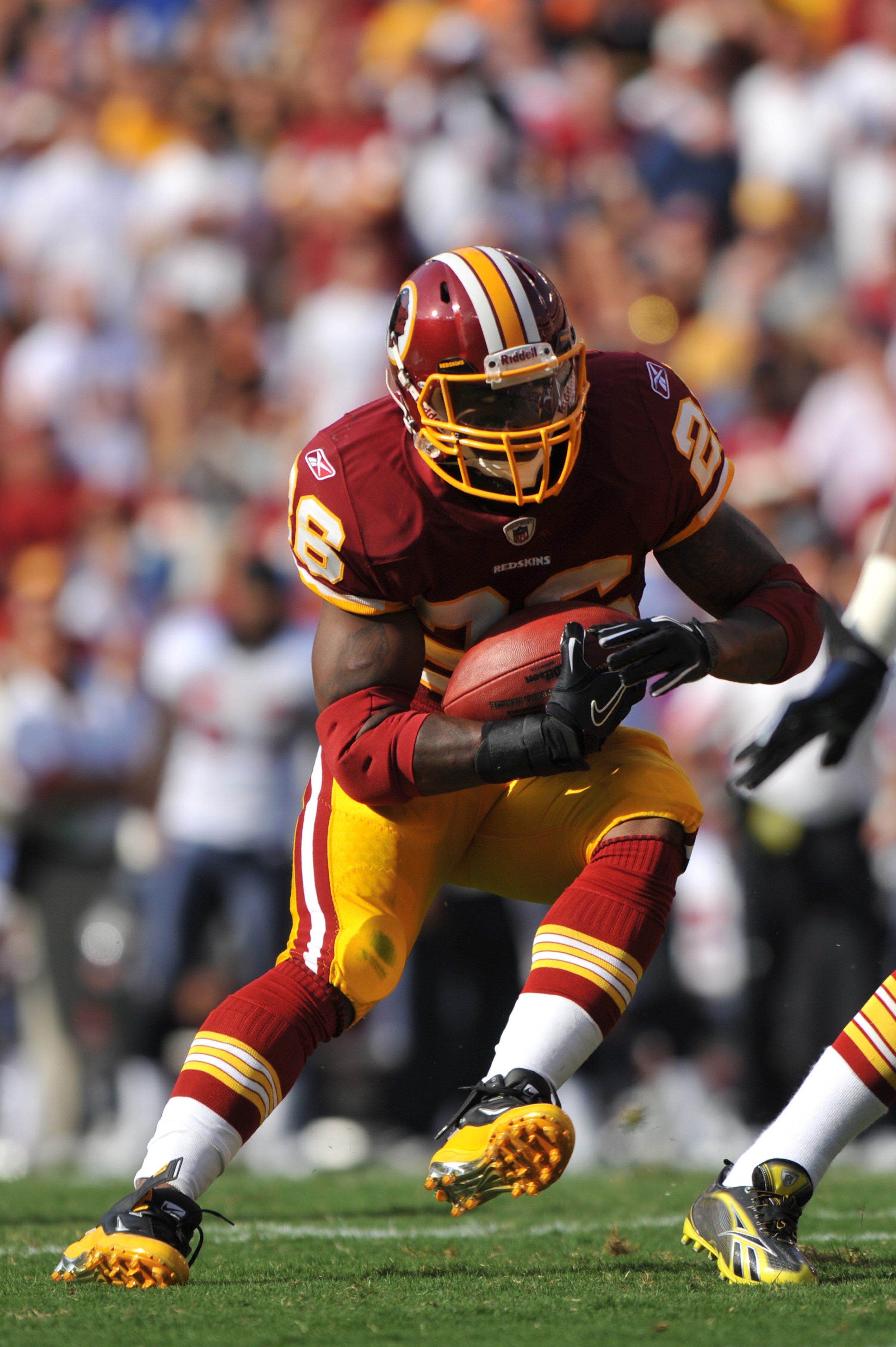 LANDOVER - SEPTEMBER 19:  Clinton Portis #26 of the Washington Redskins runs the ball during the game against the Houston Texans at FedExField on September 19, 2010 in Landover, Maryland. The Texans defeated the Redskins in overtime 30-27. (Photo by Larry