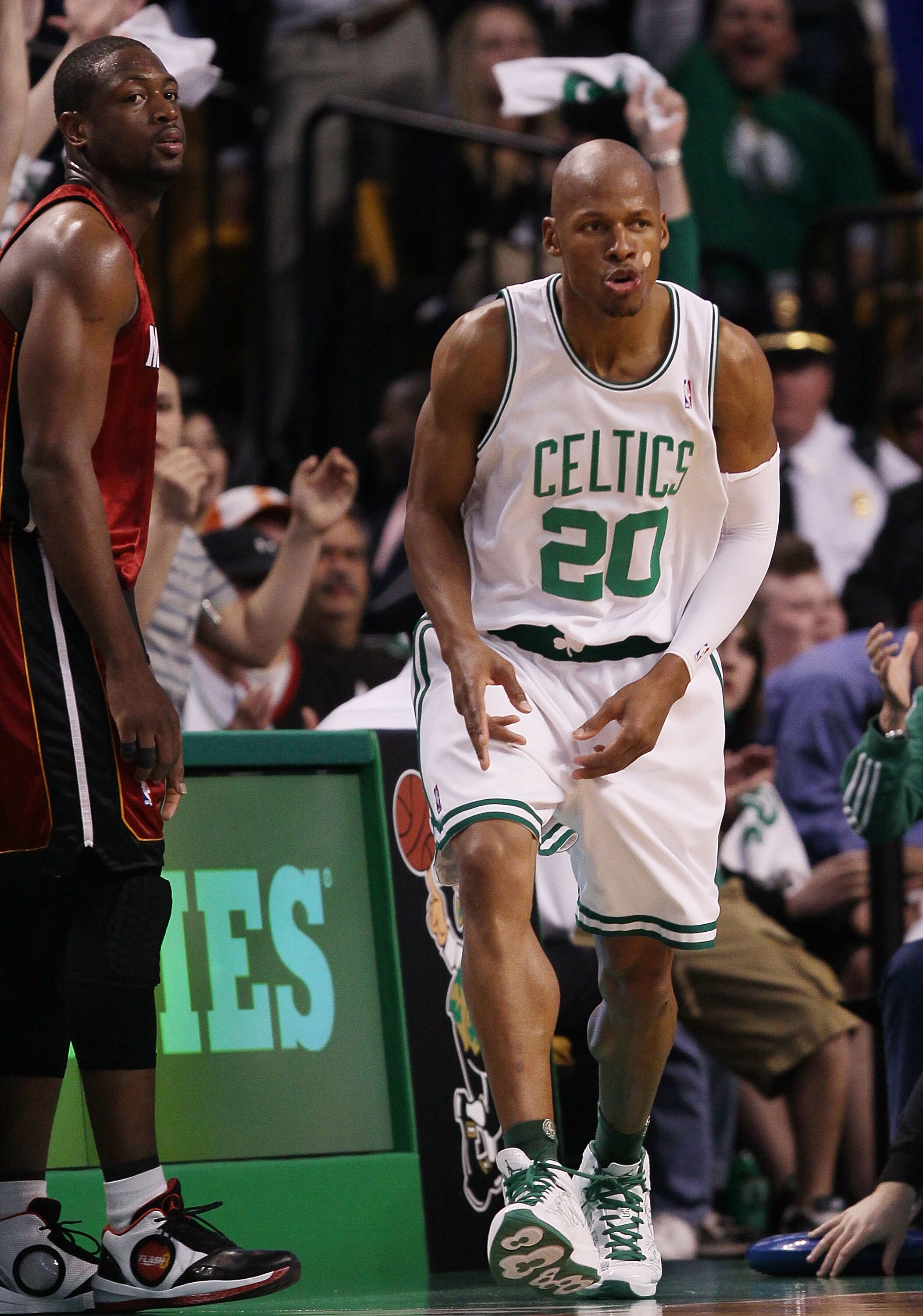 BOSTON - APRIL 20:  Ray Allen #20 of the Boston Celtics celebrates his three point shot as Dwyane Wade #3 of the Miami Heat looks on during Game Two of the Eastern Conference Quarterfinals of the 2010 NBA playoffs at the TD Garden on April 20, 2010 in Bos