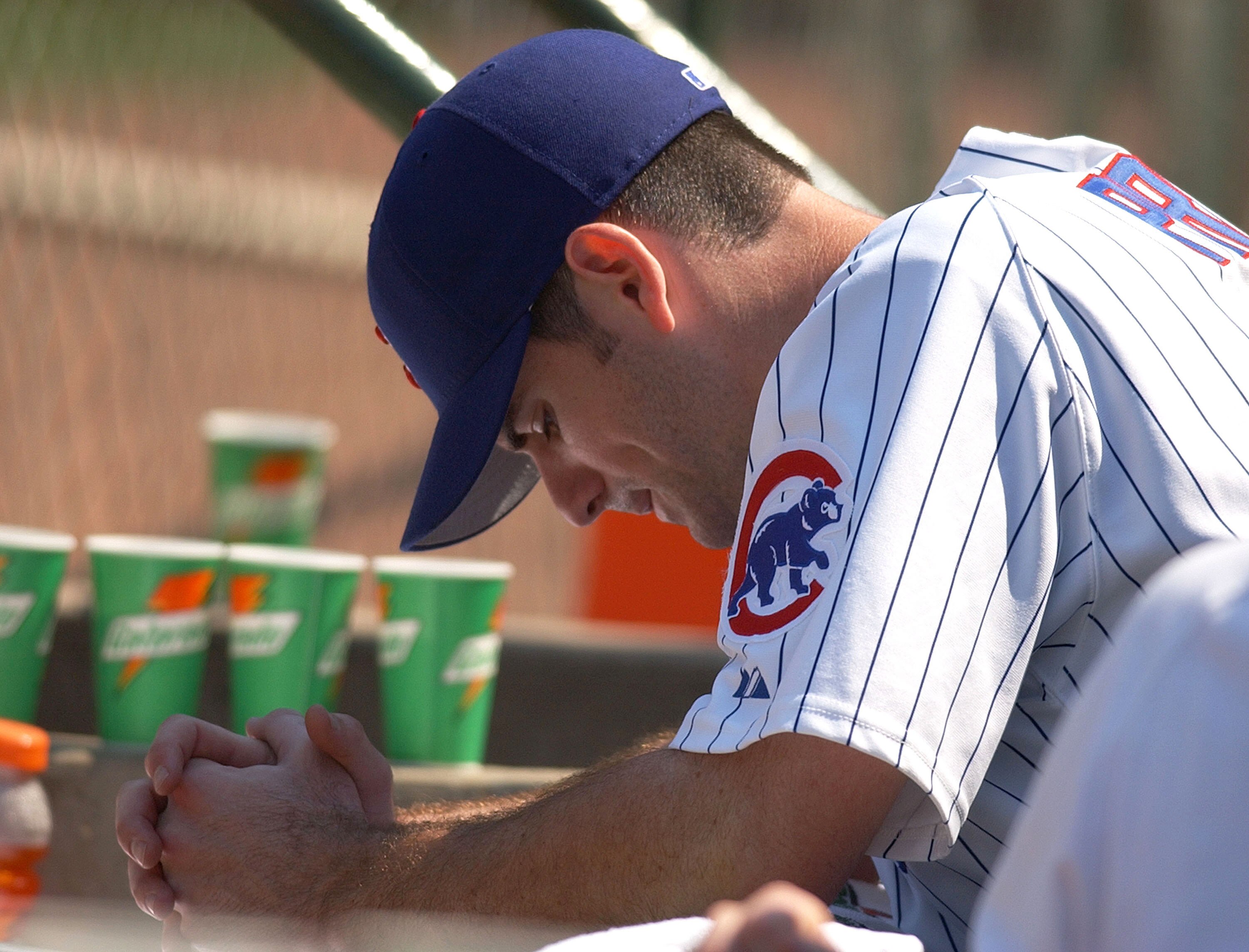 CHICAGO - JULY 1:  Mark Prior #22 of the Chicago Cubs hangs his head in the dugout after being removed from a game against the Houston Astros in the eighth inning by manager Dusty Baker on July 1, 2004 at Wrigley Field in Chicago, Illinois. (Photo by Jona
