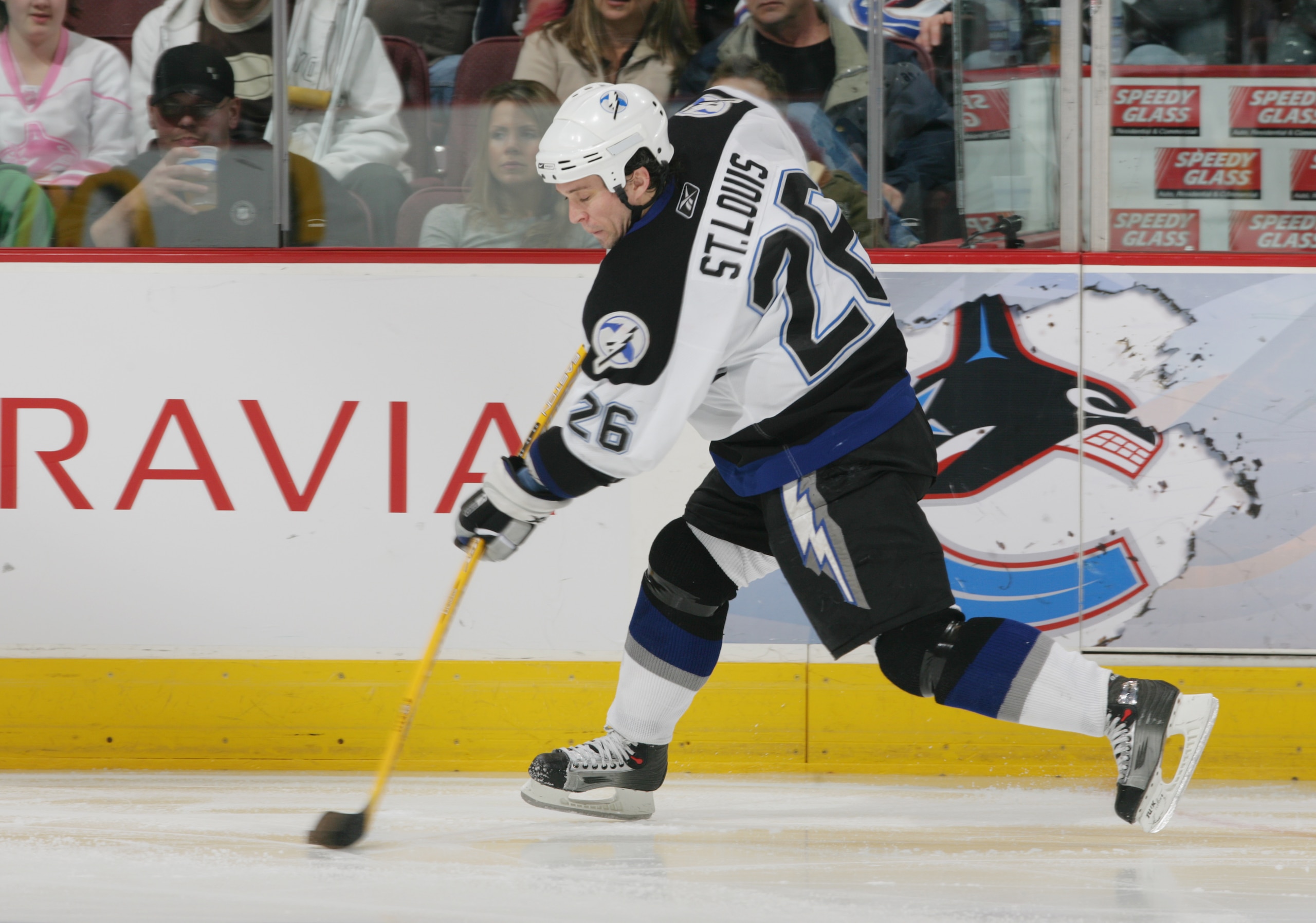 VANCOUVER, CANADA - MARCH 6:  Martin St. Louis #26  of the Tampa Bay Lightning shoots the puck against the Vancouver Canucks during their NHL game on March 6, 2007 at General Motors Place in Vancouver, Canada.  Vancouver defeated Tampa Bay 5-1.  (Photo by