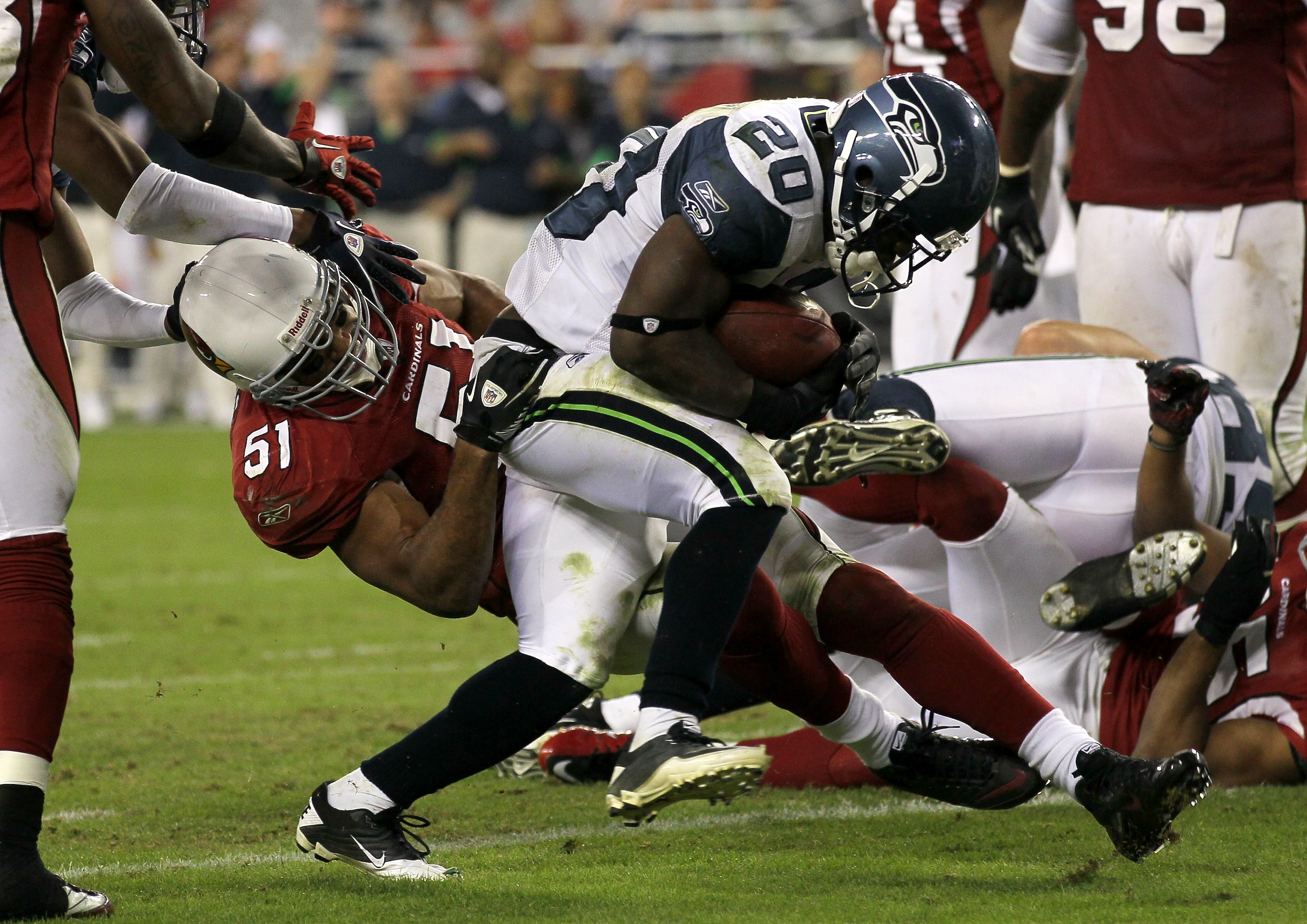 GLENDALE, AZ - NOVEMBER 14: Running back Justin Forsett #20 of the Seattle Seahawks breaks the tackle of linebacker Paris Lenon #51 of the Arizona Cardinals to score on a four yard touchdown carry in the fourth quarter at University of Phoenix Stadium on GLENDALE, AZ - NOVEMBER 14: Running back Justin Forsett #20 of the Seattle Seahawks breaks the tackle of linebacker Paris Lenon #51 of the Arizona Cardinals to score on a four yard touchdown carry in the fourth quarter at University of Phoenix Stadium on