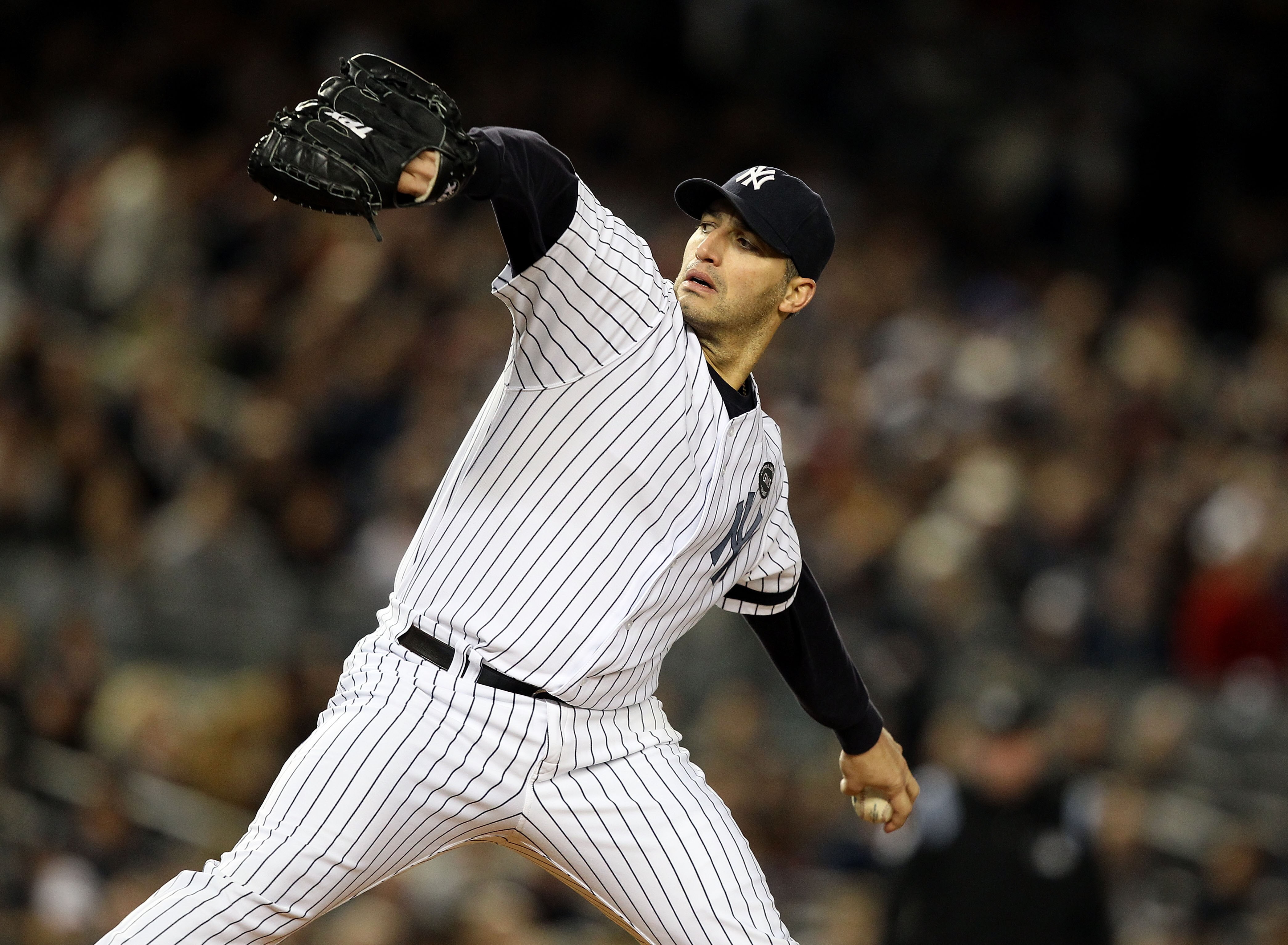 NEW YORK - OCTOBER 18:  Starting pitcher Andy Pettitte #46 of the New York Yankees pitches against the Texas Rangers in Game Three of the ALCS during the 2010 MLB Playoffs at Yankee Stadium on October 18, 2010 in New York, New York.  (Photo by Al Bello/Ge