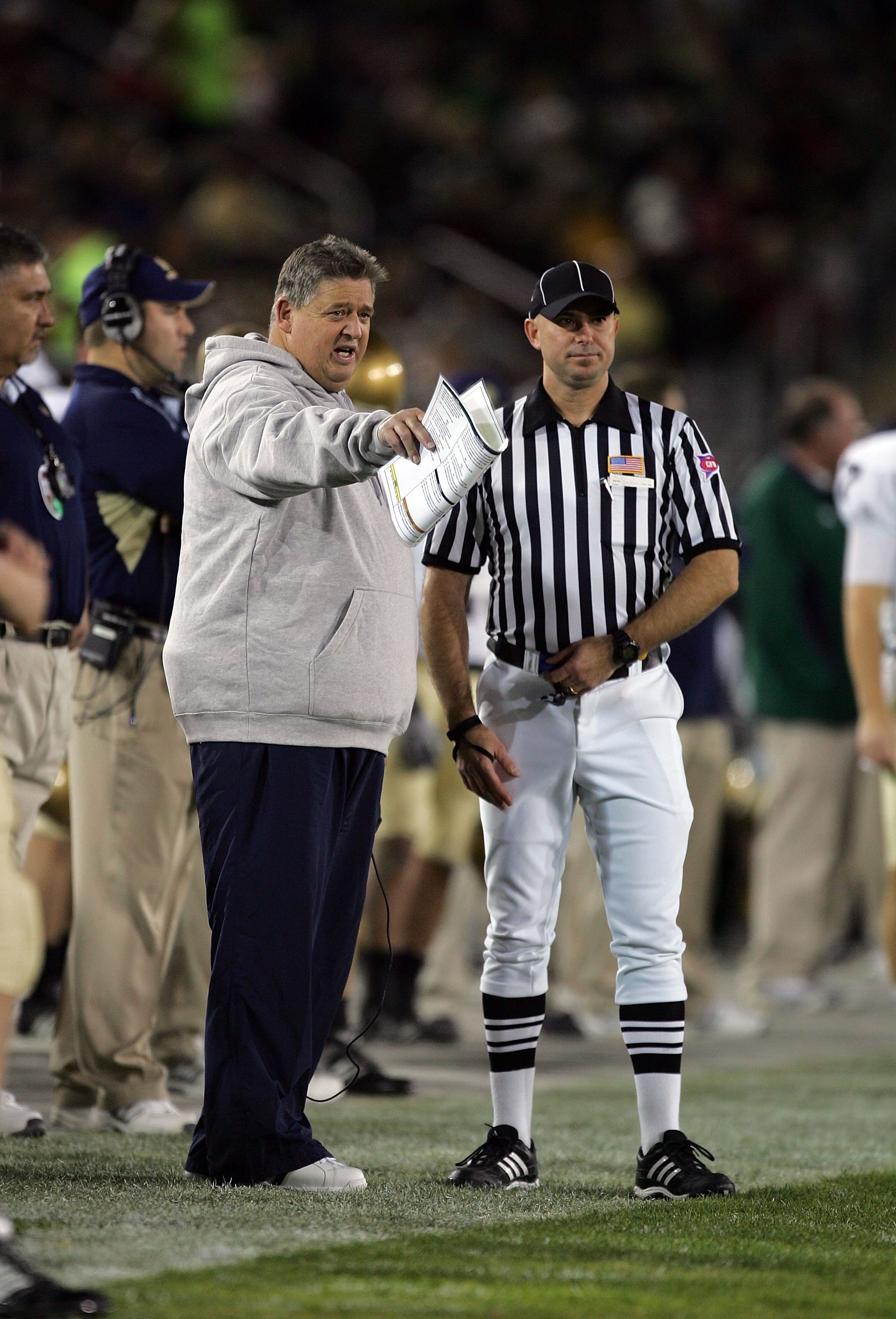PALO ALTO, CA - NOVEMBER 28:  Notre Dame head coach Charlie Weis speaks to a referee during their game against the Stanford Cardinal at Stanford Stadium on November 28, 2009 in Palo Alto, California.  (Photo by Ezra Shaw/Getty Images)